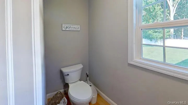 The main floor half bath is conveniently located for inside and outside use. The main floor half bath is conveniently located for inside and outside use.