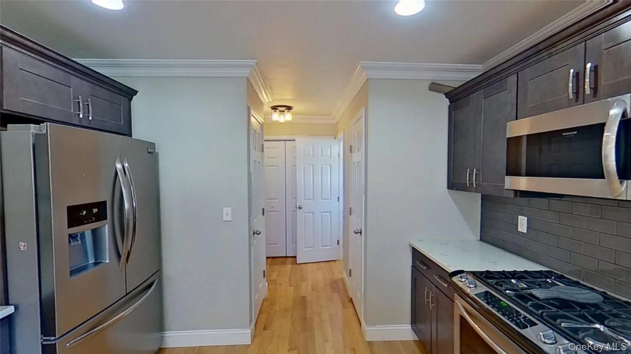 Just off the kitchen, the hardwood floors lead to a half bathroom, laundry area and a door that opens to the large double car garage. Just off the kitchen, the hardwood floors lead to a half bathroom, laundry area and a door that opens to the large double car garage.