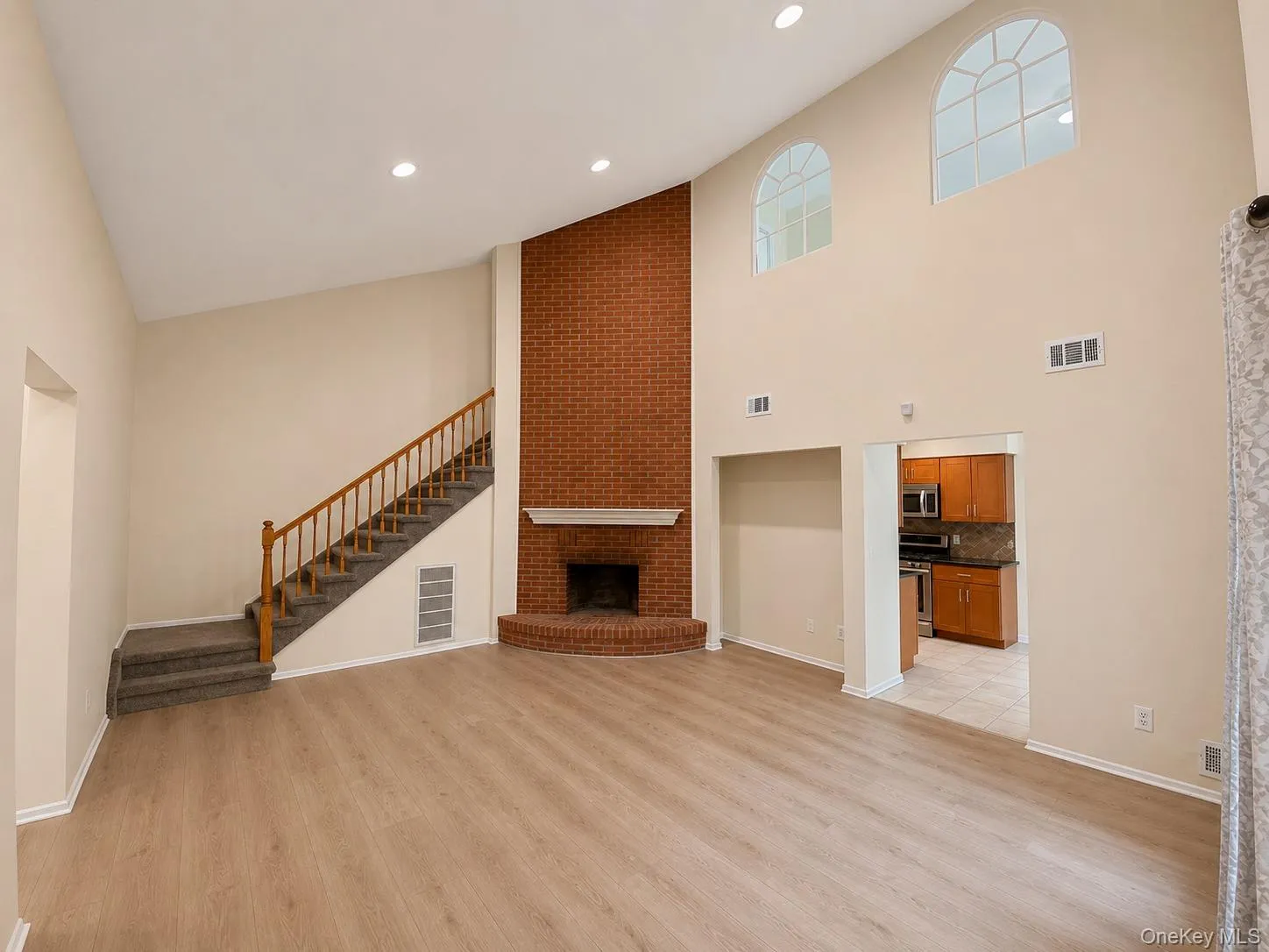 Step inside and notice the soaring ceilings and quaint fireplace. Step inside and notice the soaring ceilings and quaint fireplace.