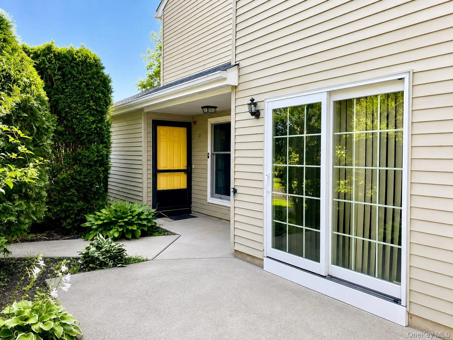 Patio with sliding doors leading to the kitchen. Patio with sliding doors leading to the kitchen.