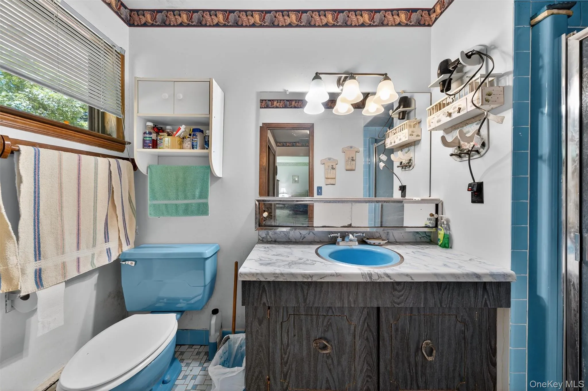 Bathroom with toilet and vanity Bathroom with toilet and vanity