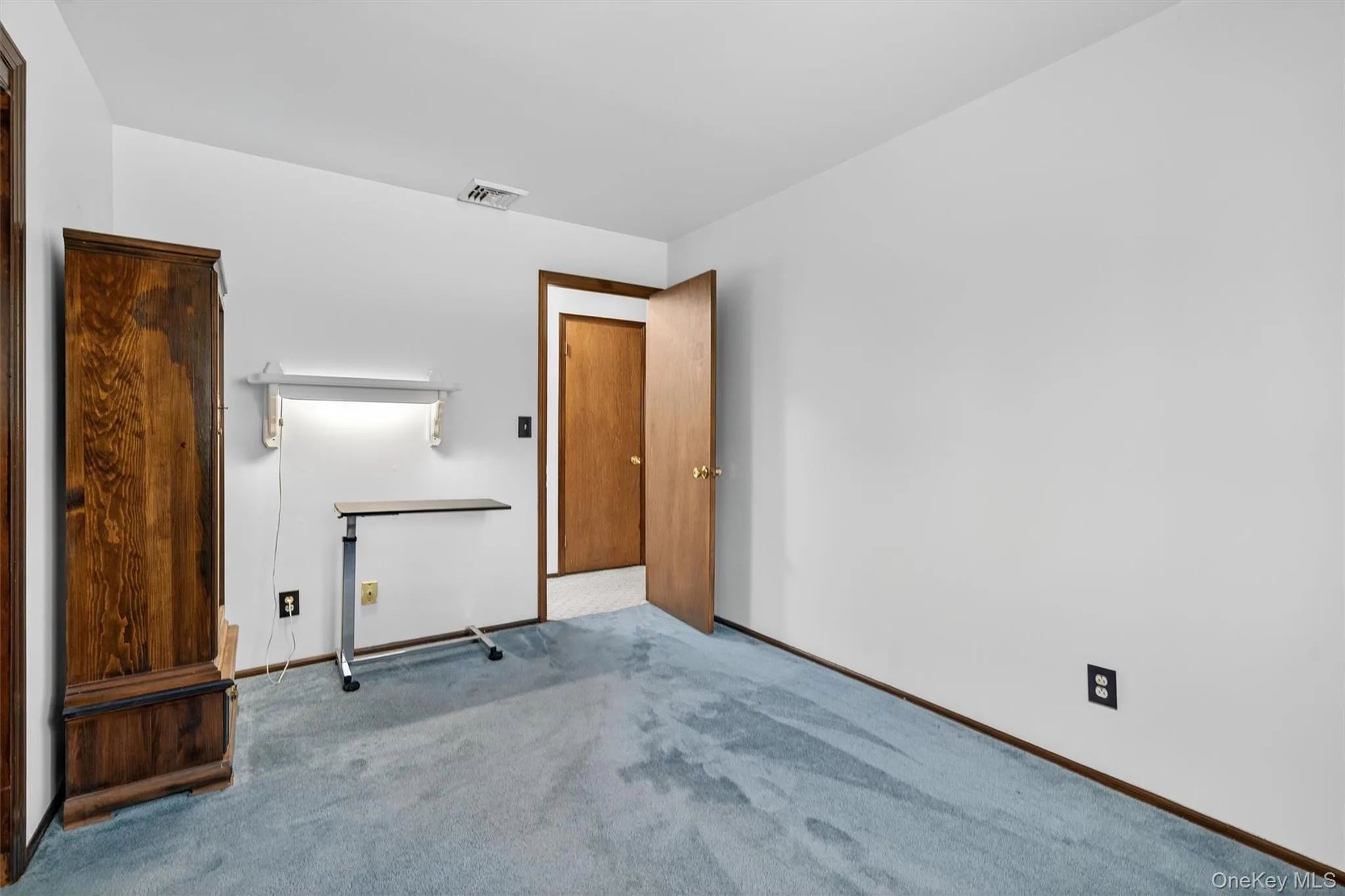 Unfurnished bedroom with carpet flooring and baseboards Unfurnished bedroom with carpet flooring and baseboards