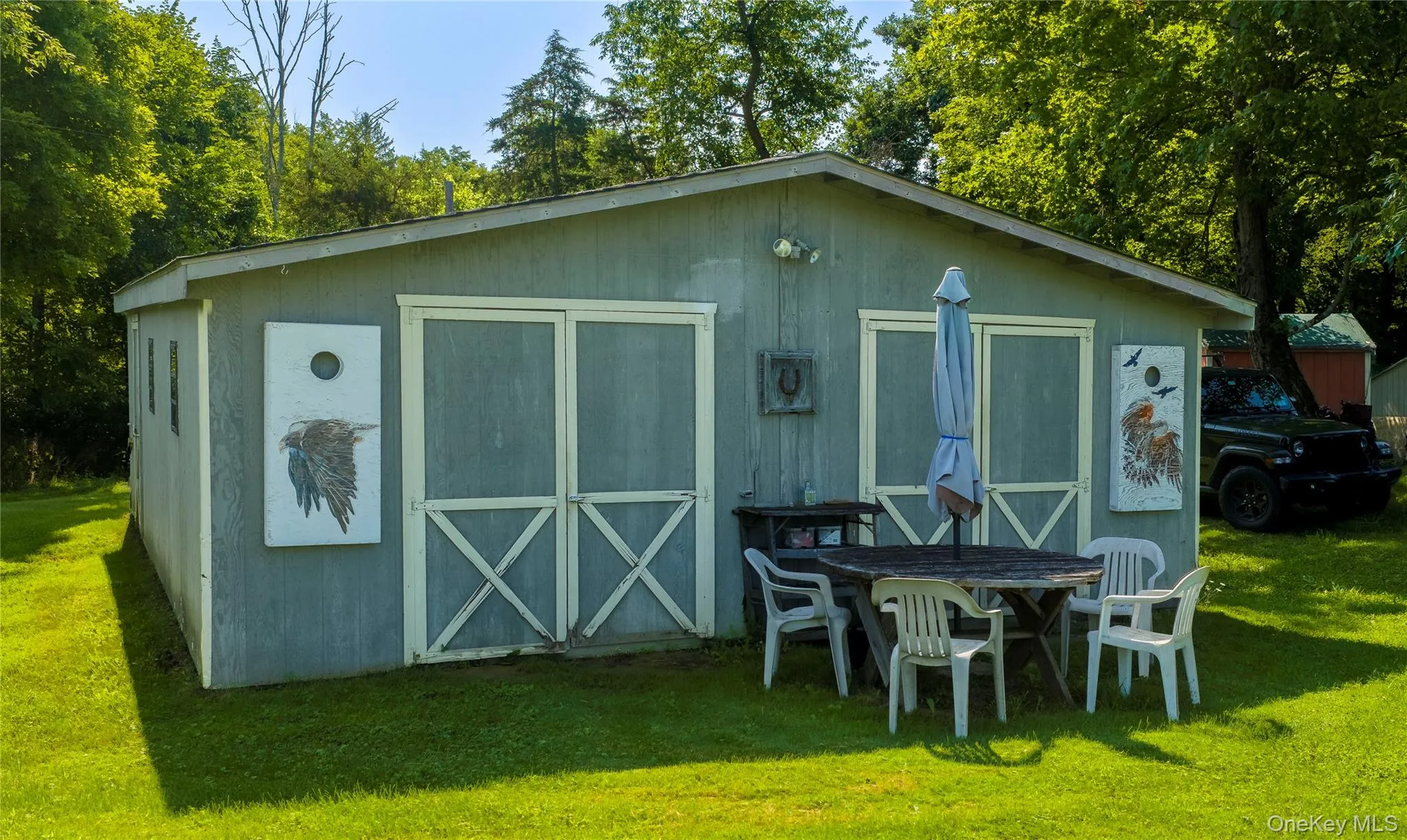 A storage barn with two barn doors. A storage barn with two barn doors.