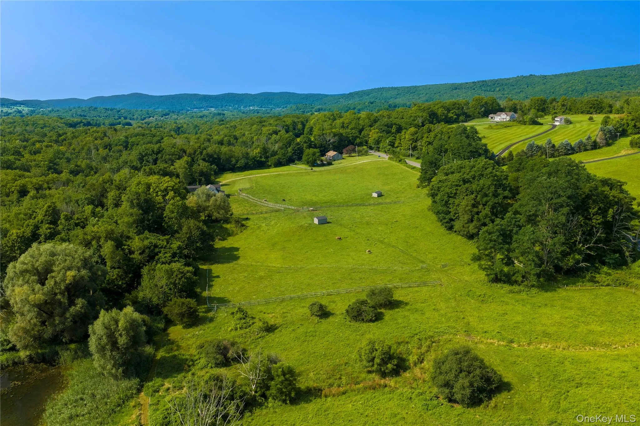 Pastures, several run-ins, and a pond in the lower left corner. Pastures, several run-ins, and a pond in the lower left corner.