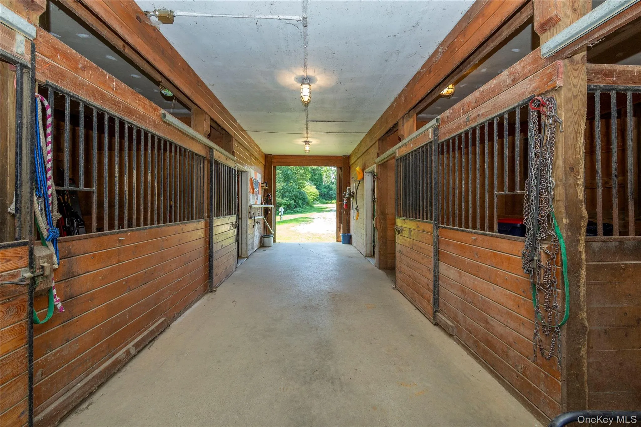 Interior view of the barn with 6 stalls in total. Interior view of the barn with 6 stalls in total.