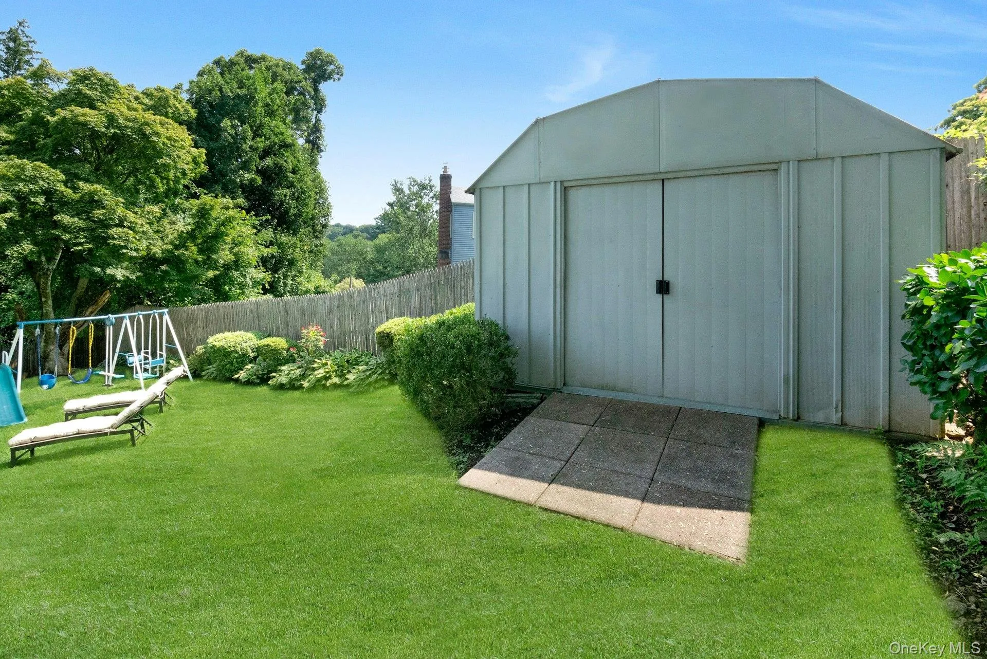 View of yard and toolshed. View of yard and toolshed.
