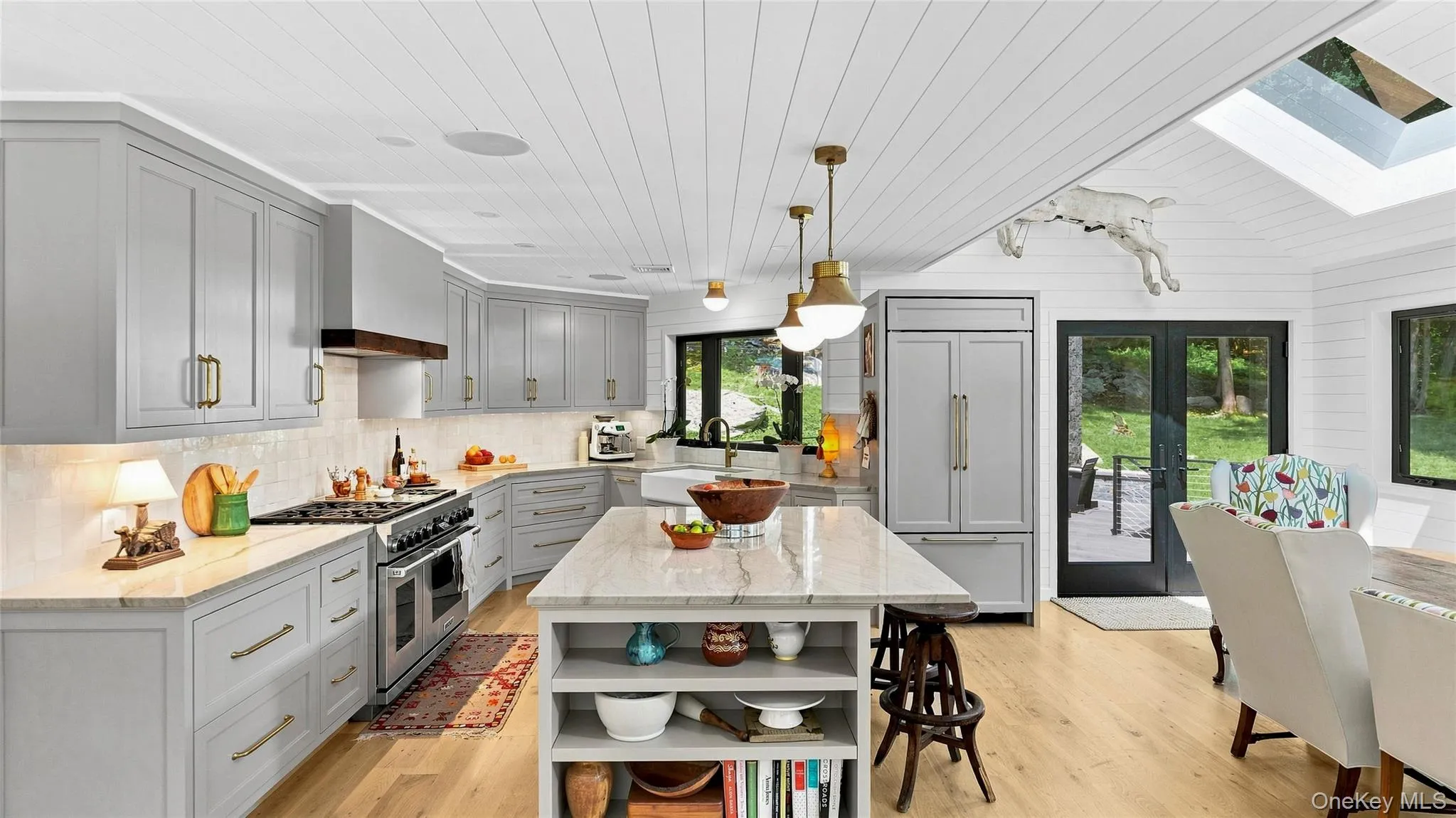Custom kitchen with generous prep space, Taj Mahal quartzite and premium appliances, open to the main living areas. Custom kitchen with generous prep space, Taj Mahal quartzite and premium appliances, open to the main living areas.