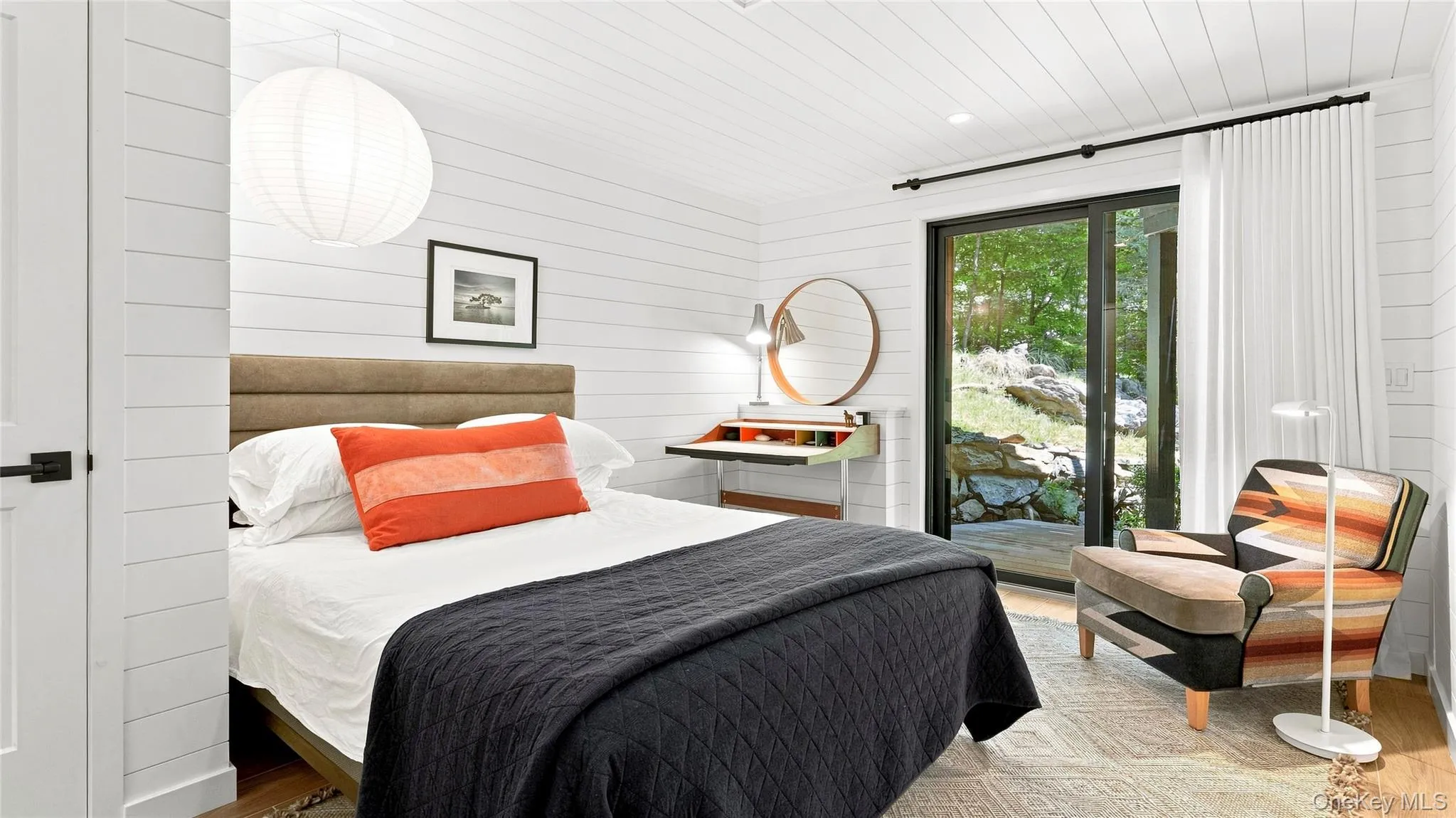 Bright, beautifully finished guest bedroom with direct access to the outdoors. Bright, beautifully finished guest bedroom with direct access to the outdoors.