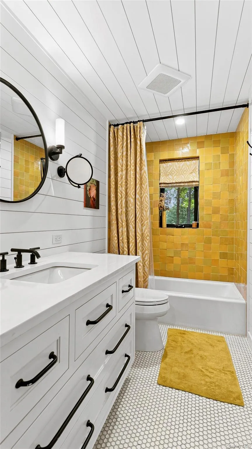 Stylish full bath with custom vanity, warm wood accents and a fresh, modern palette. Stylish full bath with custom vanity, warm wood accents and a fresh, modern palette.