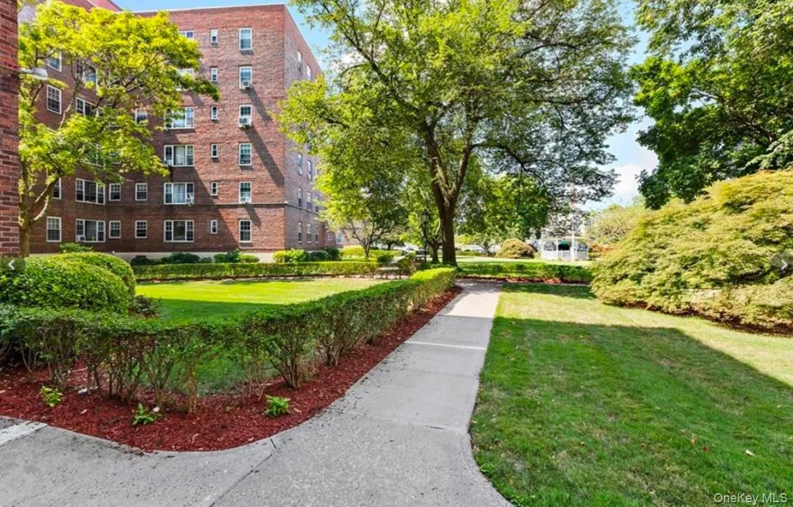View of property's community featuring a yard View of property's community featuring a yard