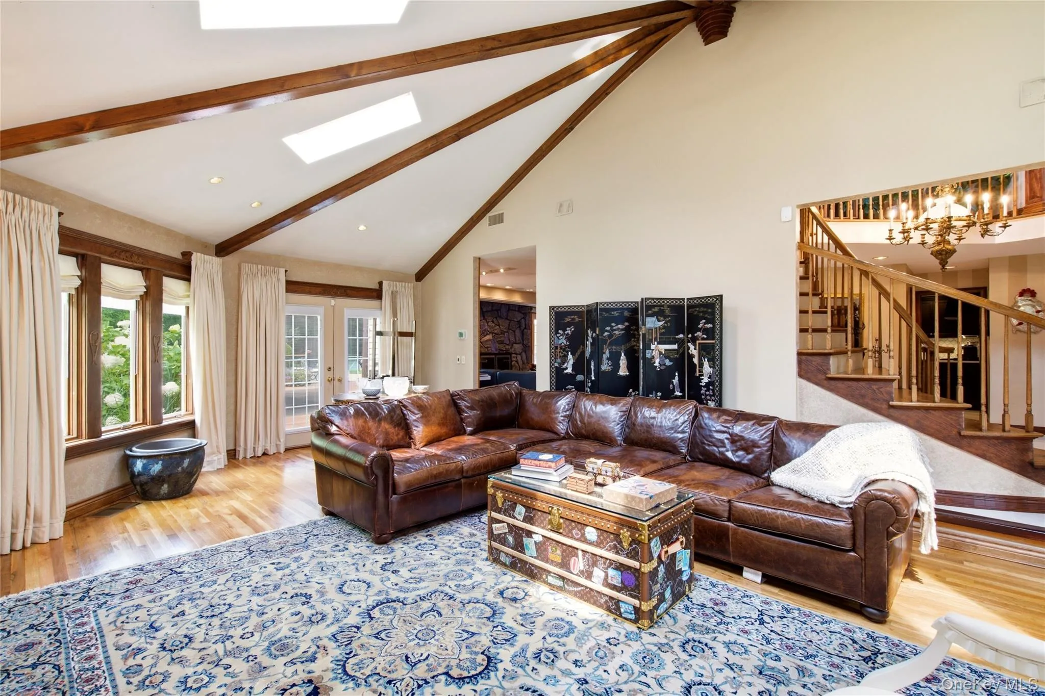 Vaulted ceiling with exposed wood beams and skylights Vaulted ceiling with exposed wood beams and skylights