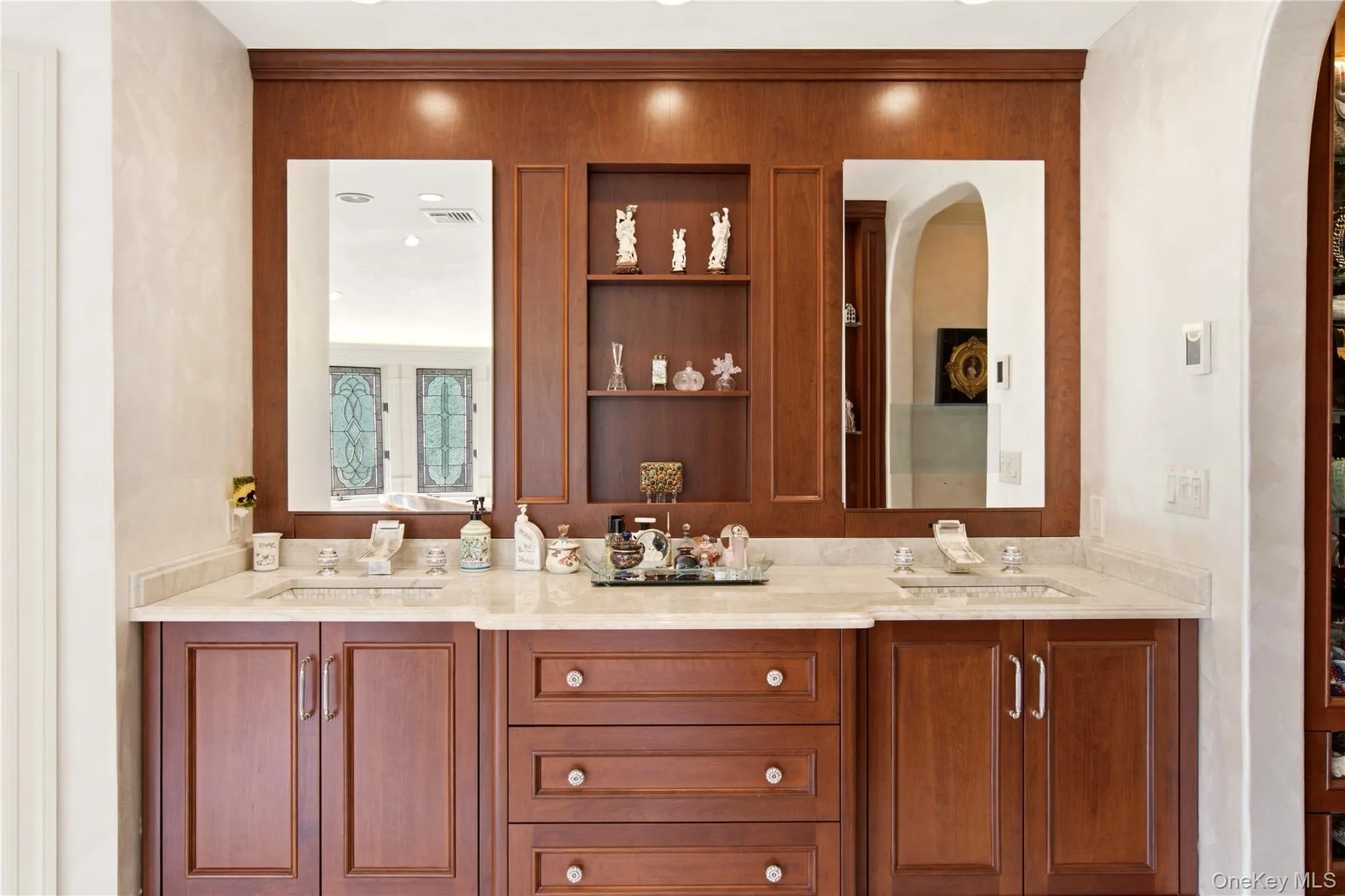 French Provincial -style vanity, with duel sinks and integrated shelving French Provincial -style vanity, with duel sinks and integrated shelving