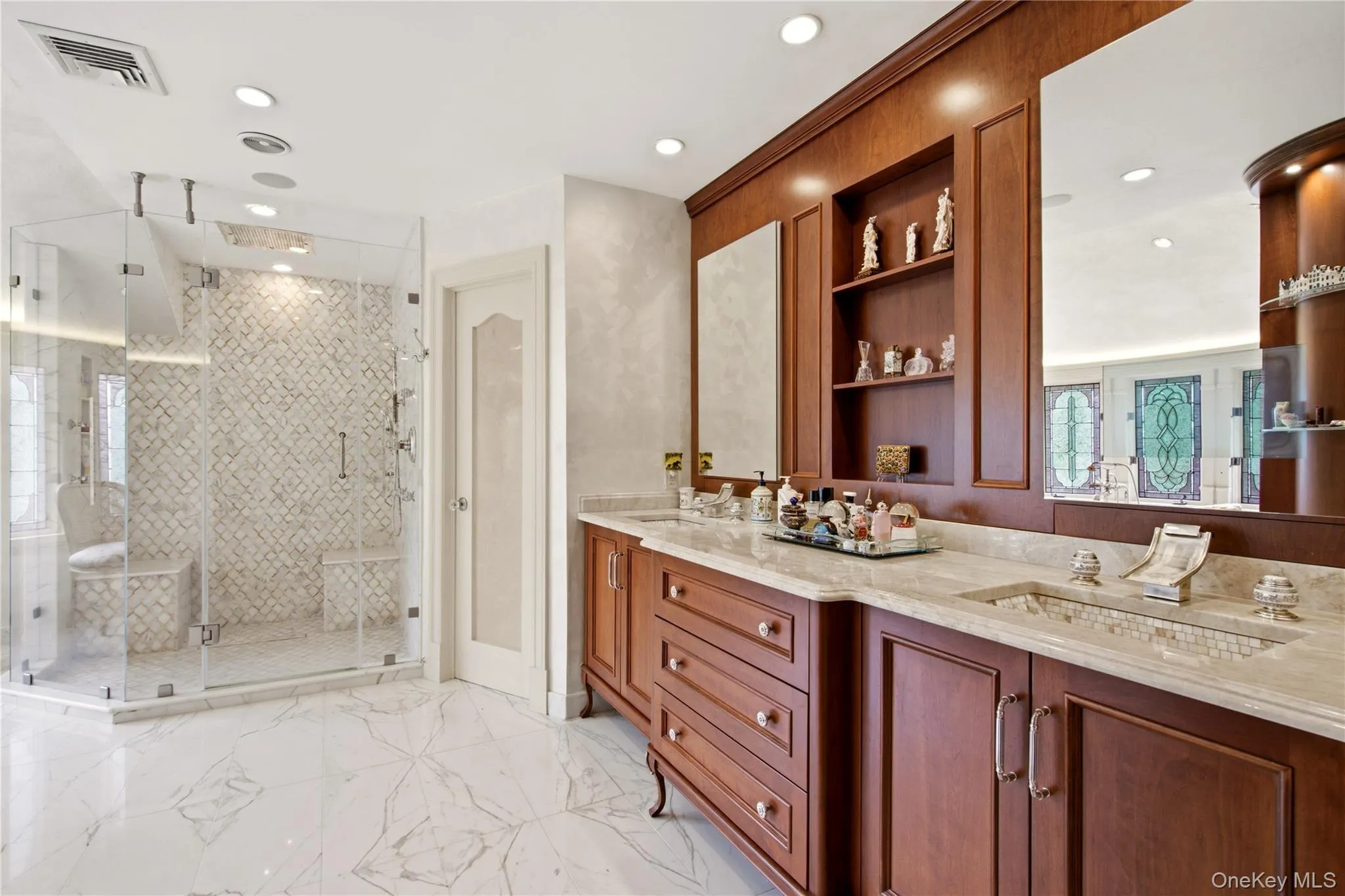 Features radiant-heated marble floors, complemented by a marble shower Features radiant-heated marble floors, complemented by a marble shower
