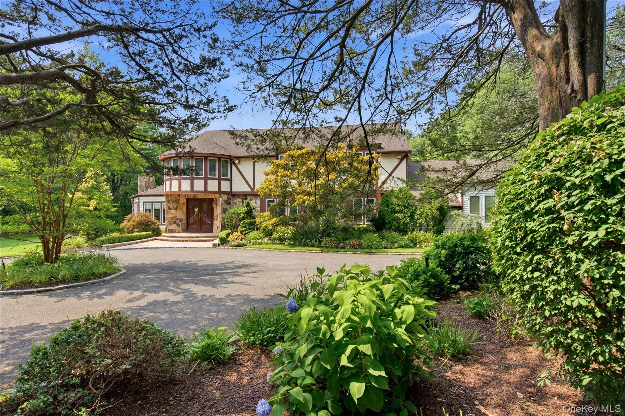 Tudor-style exterior with stone and half-timber accents. Tudor-style exterior with stone and half-timber accents.