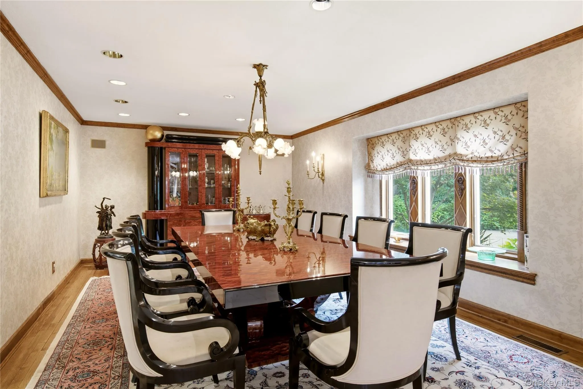 Banquet size dining room, with recessed lighting, wood-finish flooring, and crown molding Banquet size dining room, with recessed lighting, wood-finish flooring, and crown molding