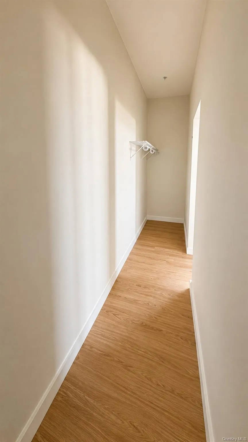 Wood-finish flooring, white wall paint, and white trim Wood-finish flooring, white wall paint, and white trim
