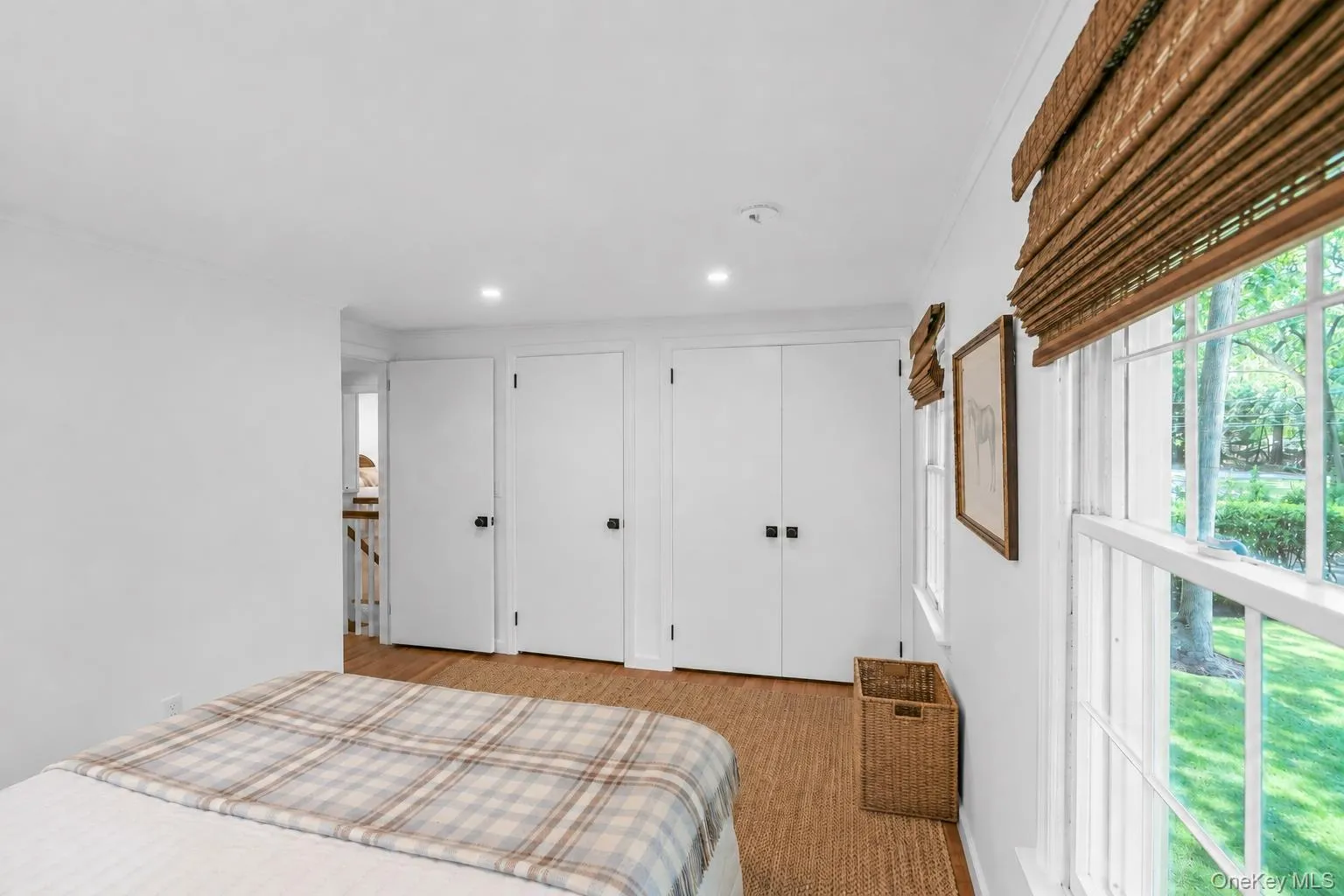 Recessed lighting, wood-finish flooring, multiple windows, window treatments, and white interior doors Recessed lighting, wood-finish flooring, multiple windows, window treatments, and white interior doors