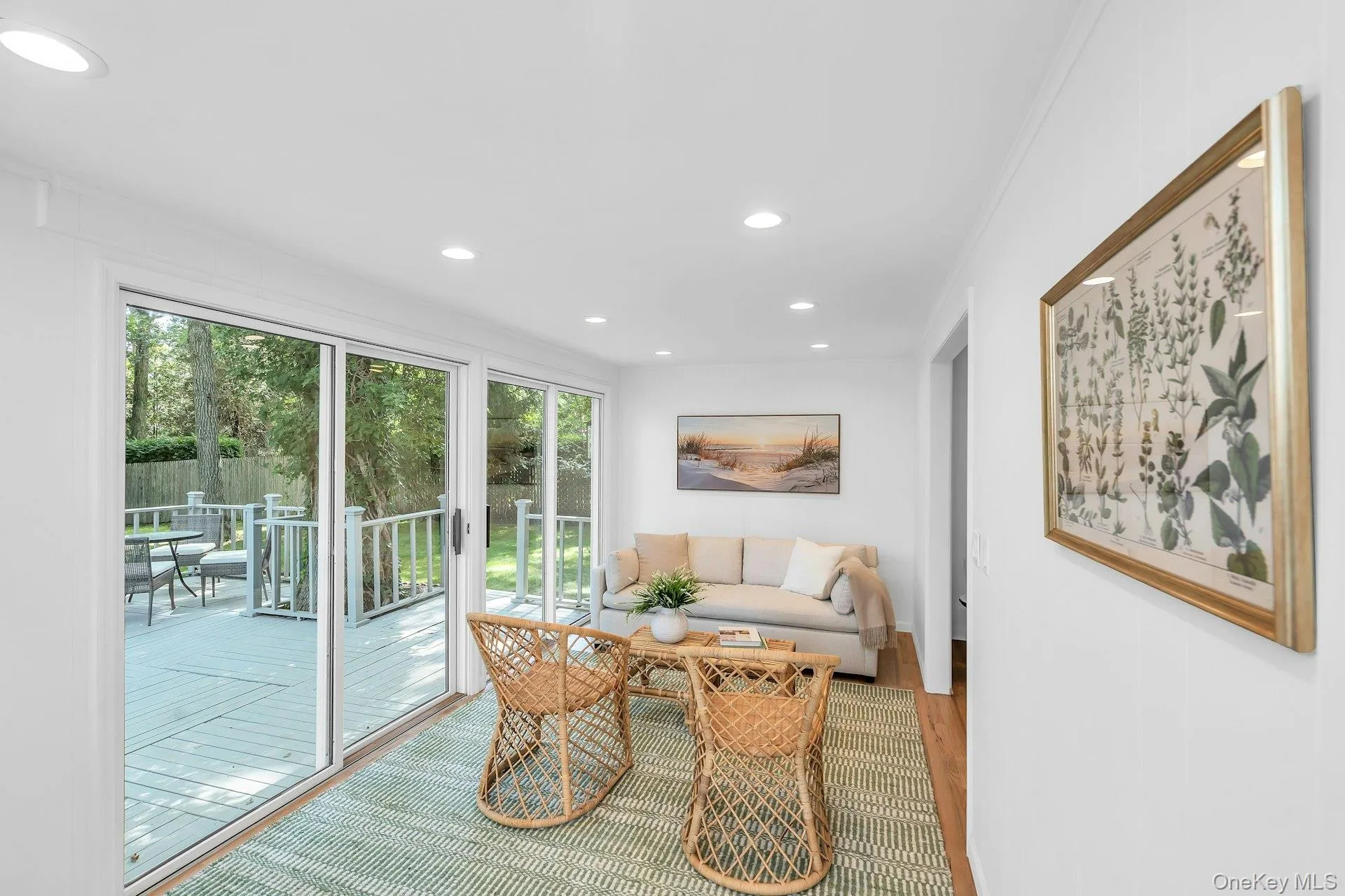 Sun room off kitchen, living room area, sliding doors to deck Sun room off kitchen, living room area, sliding doors to deck