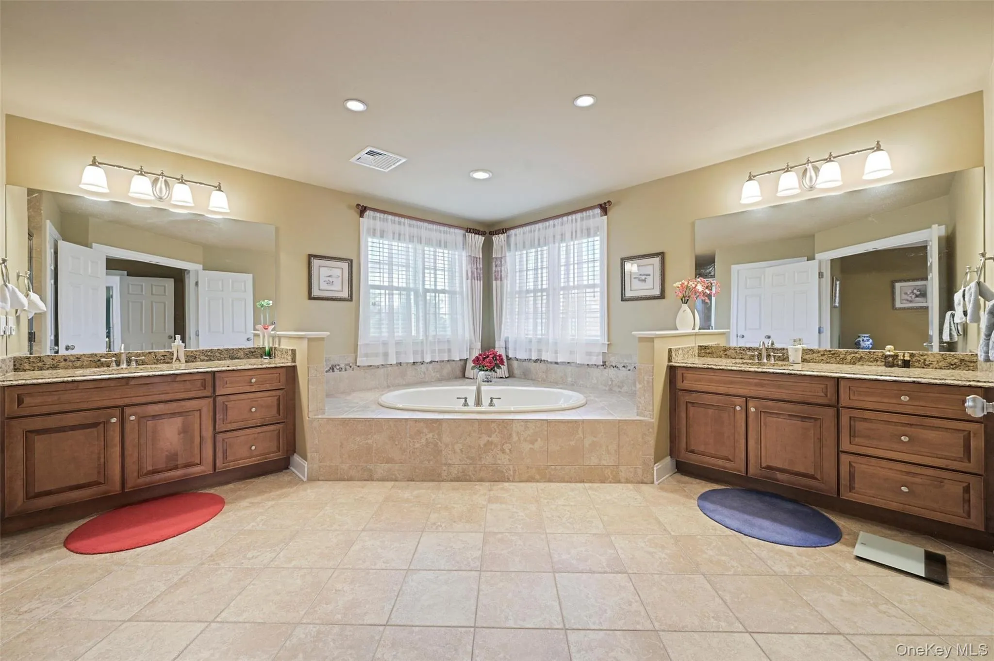 Gorgeous Primary bathroom featuring a Jacuzzi tub, large tiled shower and two vanity areas Gorgeous Primary bathroom featuring a Jacuzzi tub, large tiled shower and two vanity areas