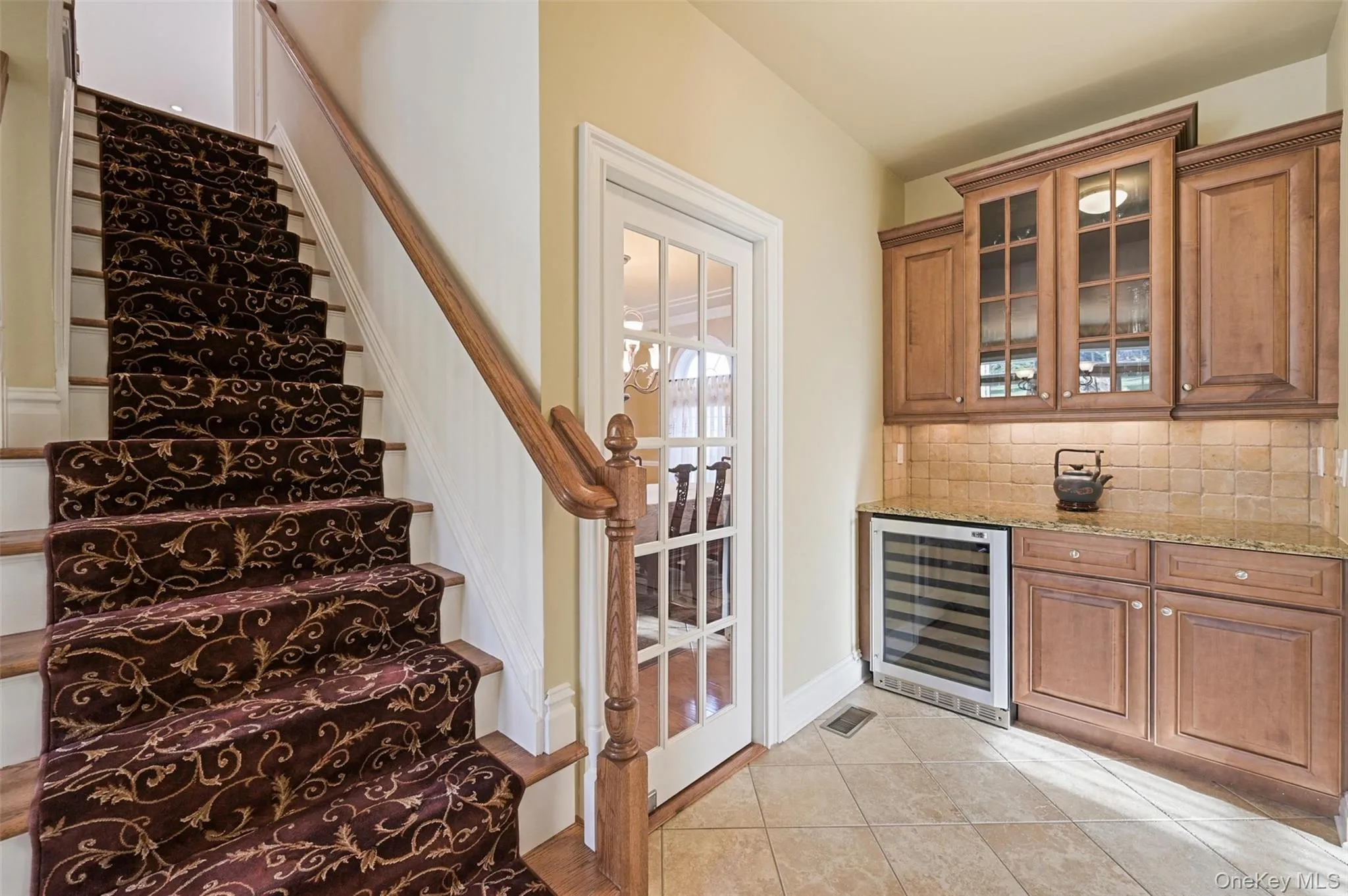 Back stairs from kitchen area lead to the second floor Back stairs from kitchen area lead to the second floor