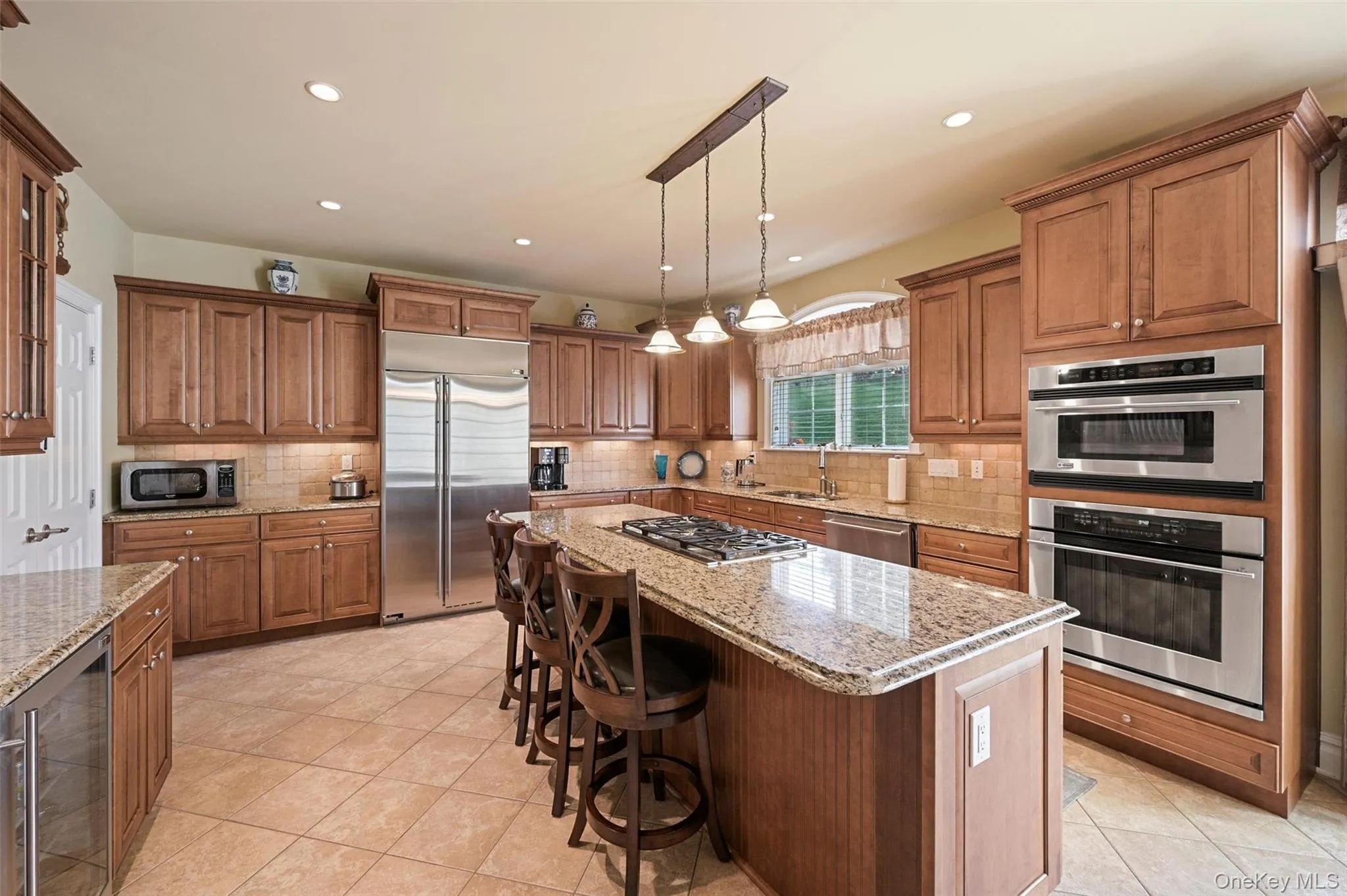 Gorgeous kitchen with large center island including a gas cooktop Gorgeous kitchen with large center island including a gas cooktop