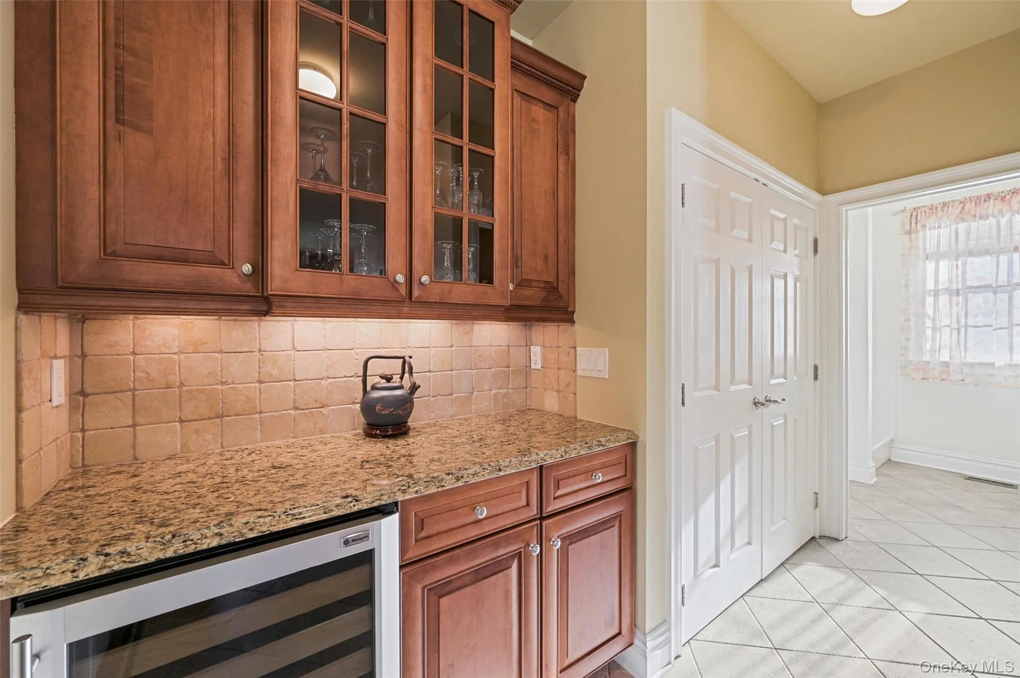 Buffet area with a wine cooler off the kitchen Buffet area with a wine cooler off the kitchen