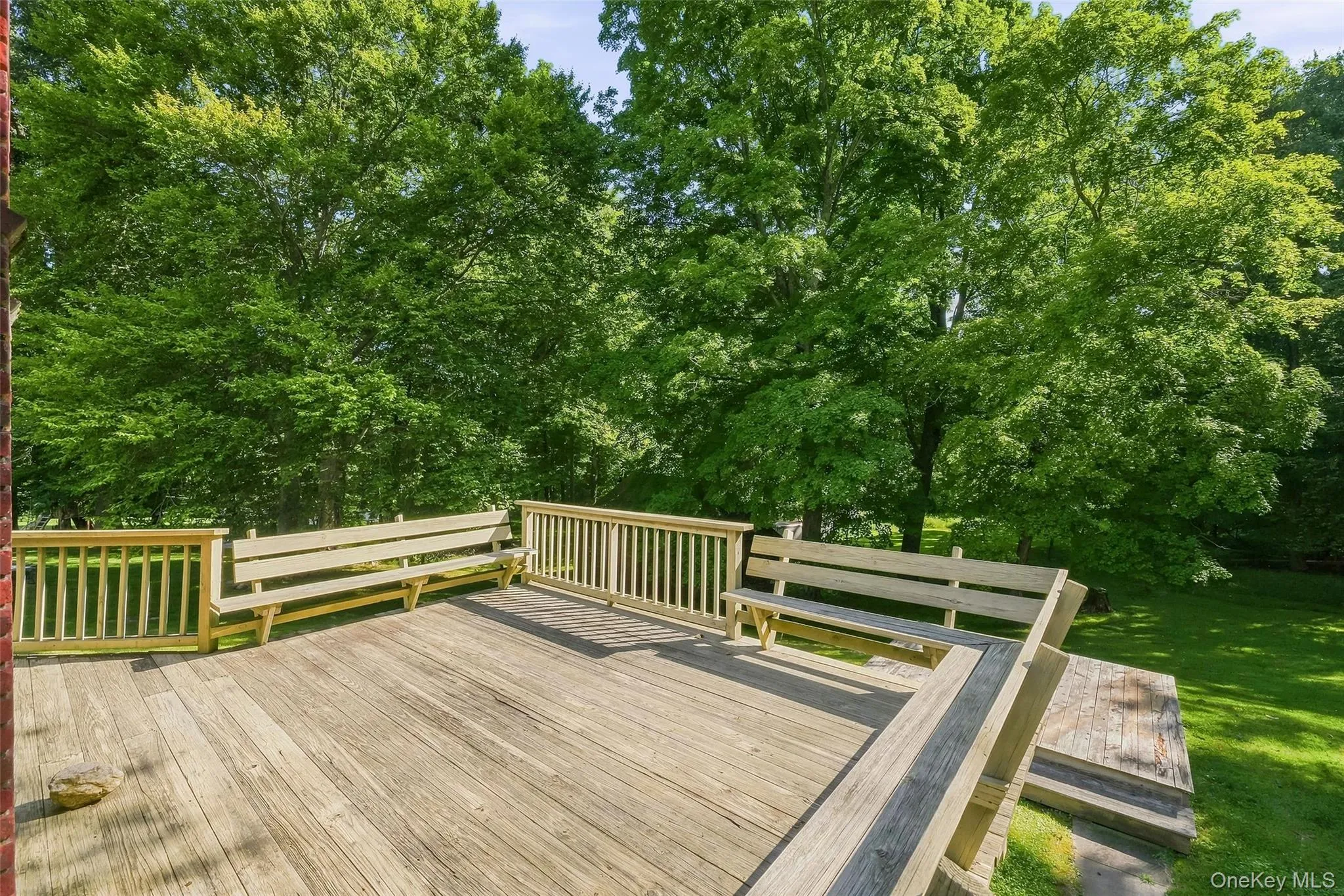 The deck overlooks the expansive yard. The deck overlooks the expansive yard.