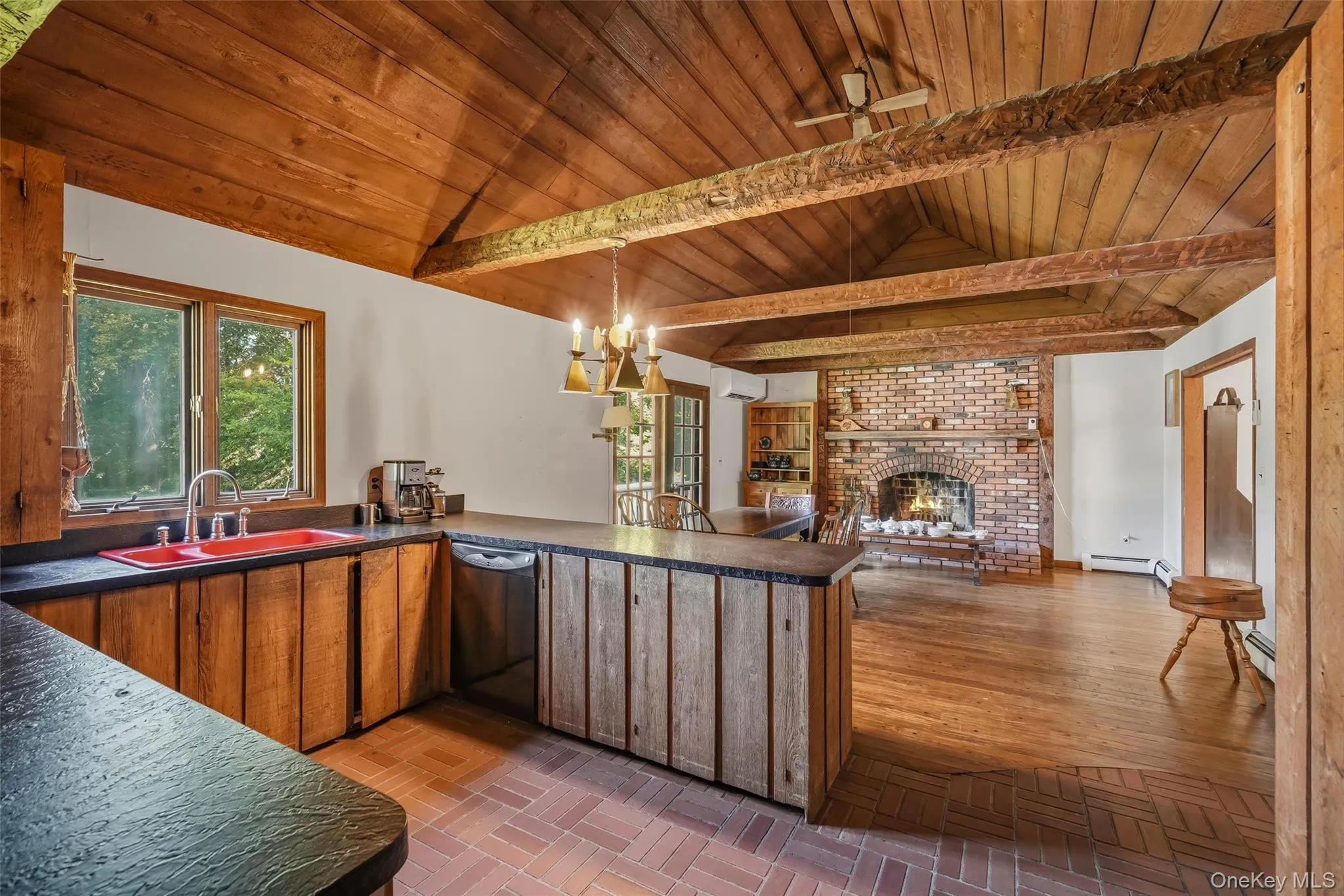 The kitchen is open to the family room. Notice the custom designed, open-beamed ceiling. The kitchen is open to the family room. Notice the custom designed, open-beamed ceiling.