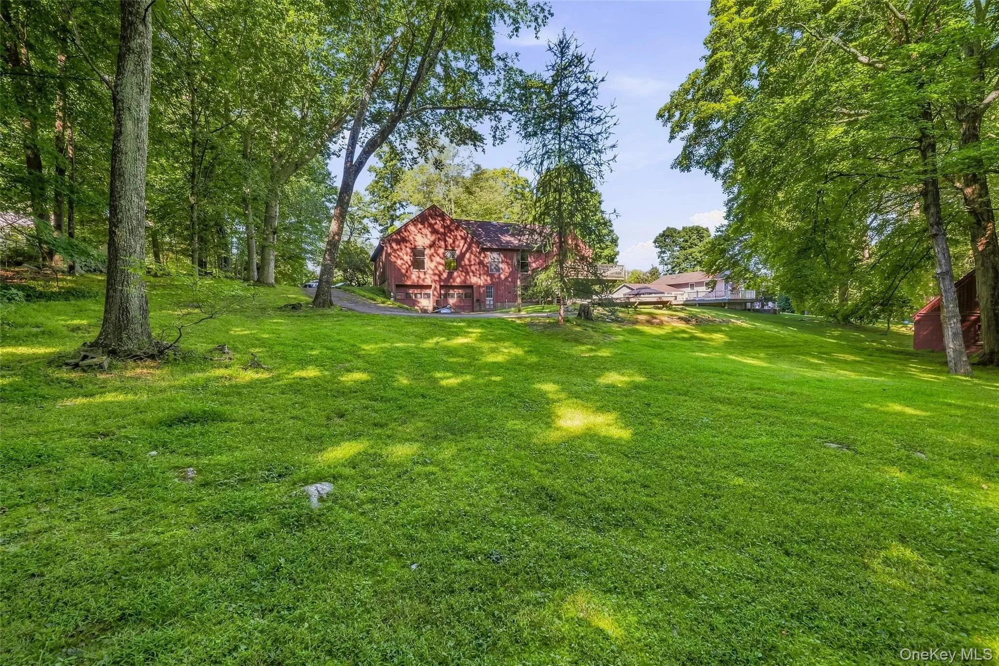 Another view of the yard and rear of the house. Another view of the yard and rear of the house.
