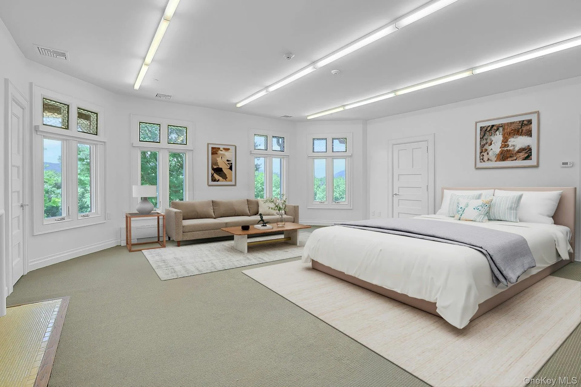 To the left of the sitting room is the possible first bedroom on this floor. Virtually staged, this expansive, bright room has ample space for a bed, seating area and entertainment nook. There is a closet on the left. To the left of the sitting room is the possible first bedroom on this floor. Virtually staged, this expansive, bright room has ample space for a bed, seating area and entertainment nook. There is a closet on the left.