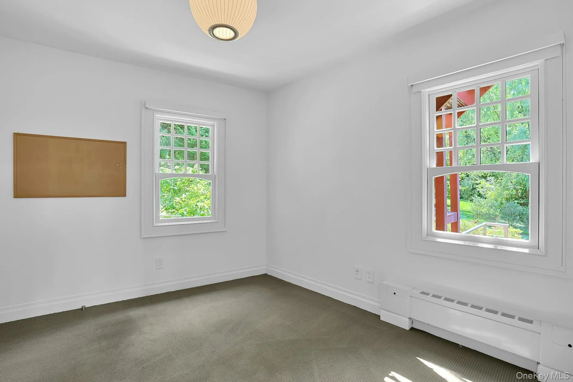 Now used as an office, this rear room, just next to the bathrooms and a large potential closet, could be a great first floor bedroom. With two exposures to the private, tree ensconced rear yard, this would be a quiet and private retreat. Now used as an office, this rear room, just next to the bathrooms and a large potential closet, could be a great first floor bedroom. With two exposures to the private, tree ensconced rear yard, this would be a quiet and private retreat.
