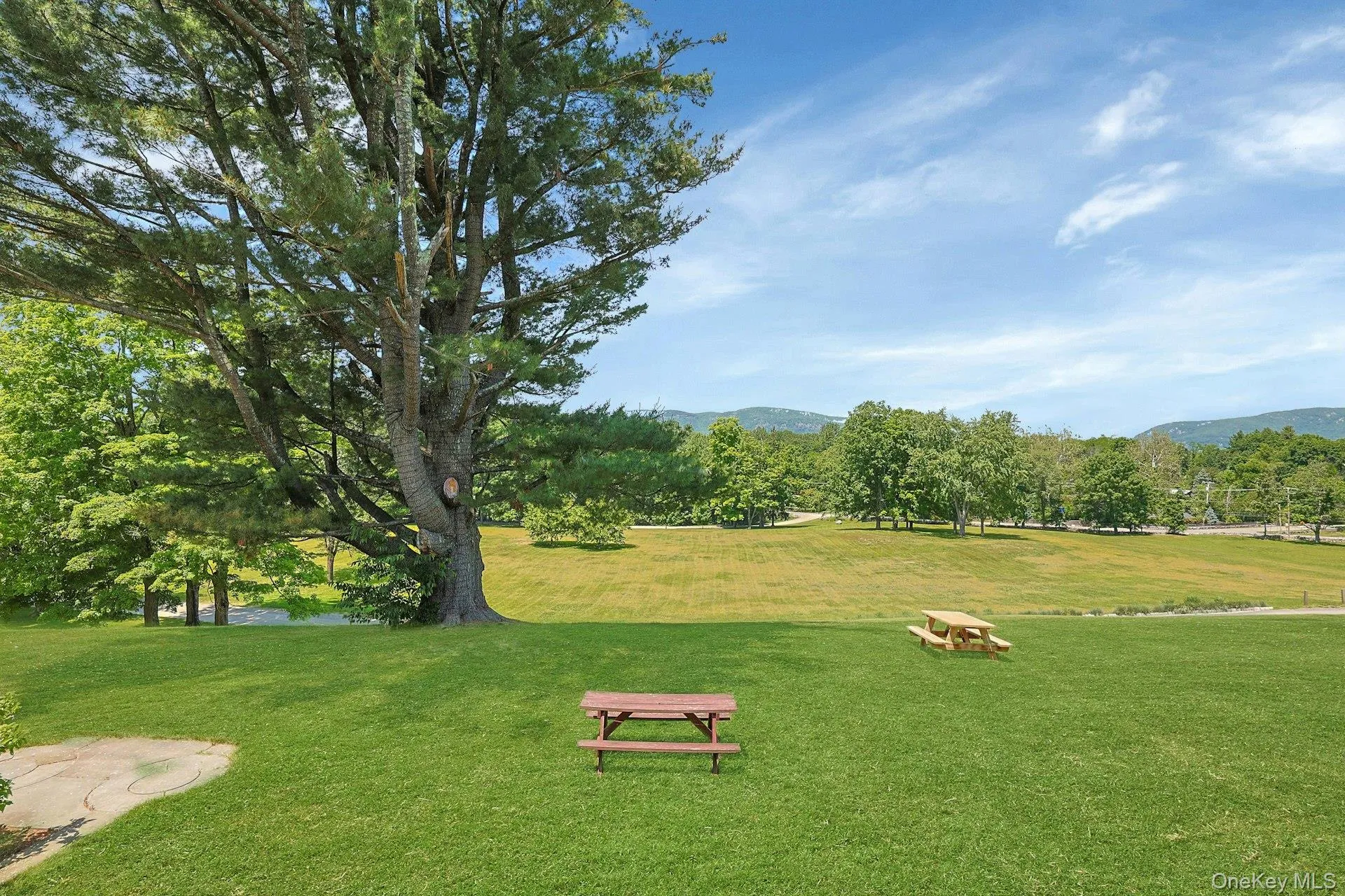 Sprawling fields below and picnic areas atop the rolling hills of the property greet you at the edge of the front patio. The possibilities for gardens here are endless. Sprawling fields below and picnic areas atop the rolling hills of the property greet you at the edge of the front patio. The possibilities for gardens here are endless.