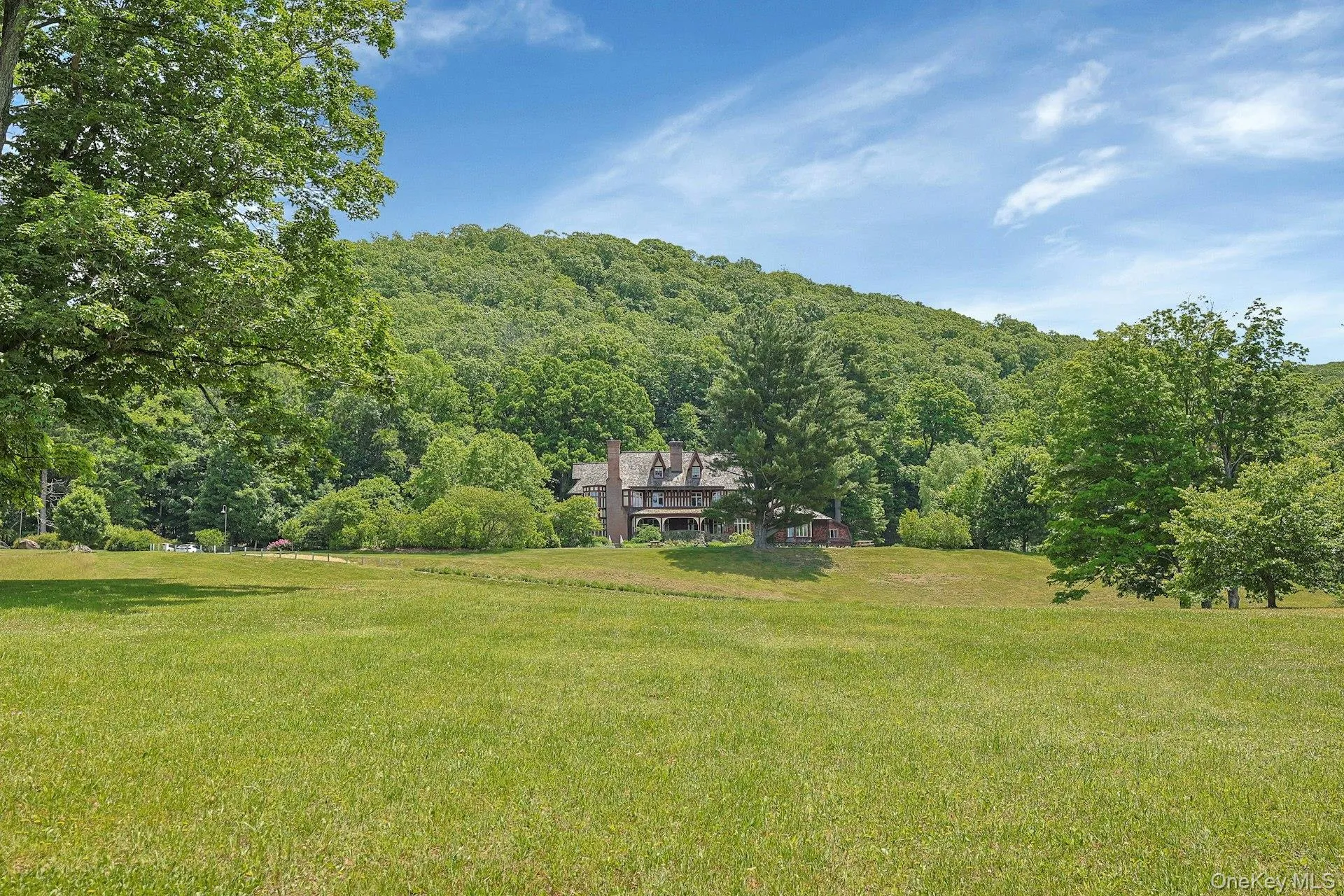 Taken from the driveway, this image captures the expansiveness of the grounds. Taken from the driveway, this image captures the expansiveness of the grounds.