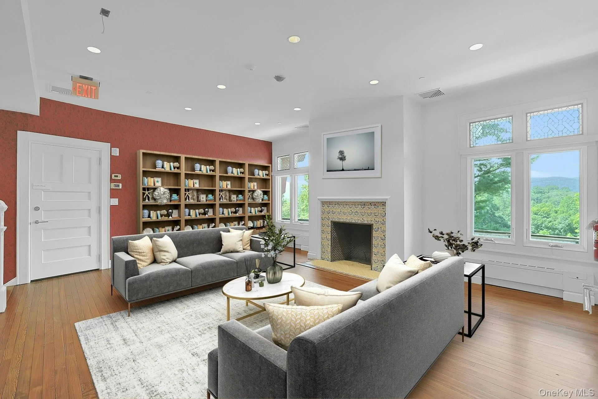 On the second floor, this large and open room has been virtually staged as a sitting room or library. Like so many other rooms in this house, it's centered on a unique fireplace with original tile work. From the windows, there are panoramic views out to the Hudson River Valley. On the second floor, this large and open room has been virtually staged as a sitting room or library. Like so many other rooms in this house, it's centered on a unique fireplace with original tile work. From the windows, there are panoramic views out to the Hudson River Valley.