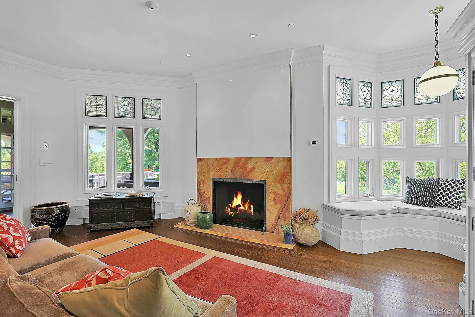 This room has its own fireplace and plenty of space for seating. Restored stained glass windows over new, energy efficient ones perfectly capture the meeting of original craftsmanship and modern building materials. This room has its own fireplace and plenty of space for seating. Restored stained glass windows over new, energy efficient ones perfectly capture the meeting of original craftsmanship and modern building materials.