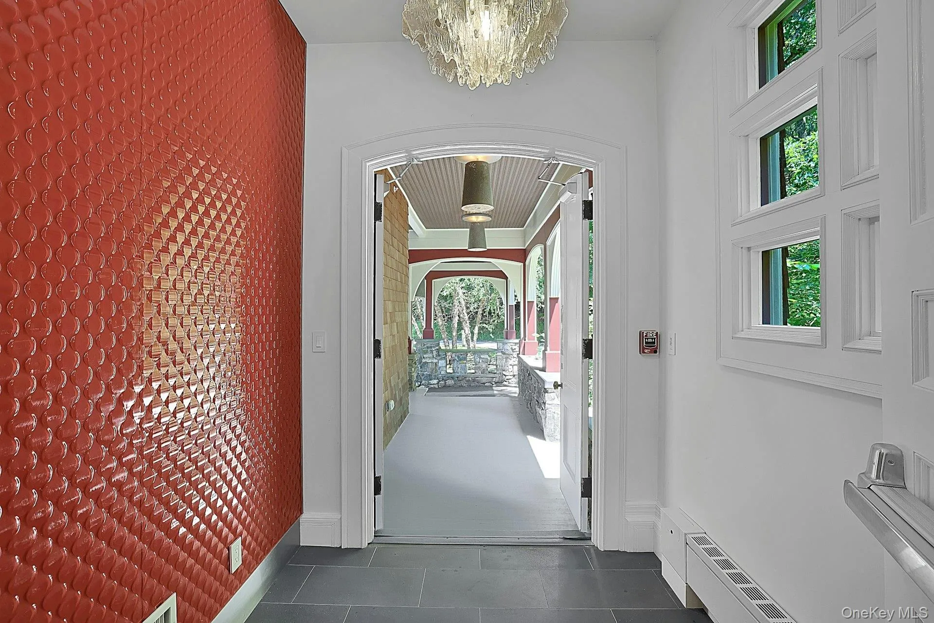 The first hint of the countless updates that have been made at this property. When you first enter the foyer through the original double doors, you will find an electronic entrance system and a new, artful, modern wall. We look out to the deep wrap-around porch with well designed exterior lighting. The first hint of the countless updates that have been made at this property. When you first enter the foyer through the original double doors, you will find an electronic entrance system and a new, artful, modern wall. We look out to the deep wrap-around porch with well designed exterior lighting.