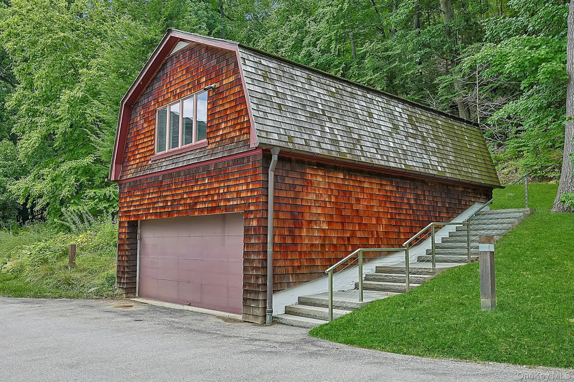The guest cottage, atop the two car garage, is a perfect spot for both short and long term guests. The staircase on the right leads up to the entrance to the cottage. The guest cottage, atop the two car garage, is a perfect spot for both short and long term guests. The staircase on the right leads up to the entrance to the cottage.