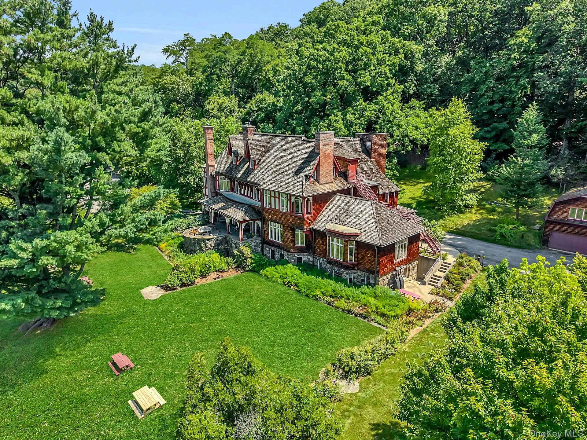 As we start to rise above the home, we can appreciate the craftsmanship of the cedar roof, the beauty of the brick chimneys, and the convenience and safety of the fire escape. As we start to rise above the home, we can appreciate the craftsmanship of the cedar roof, the beauty of the brick chimneys, and the convenience and safety of the fire escape.