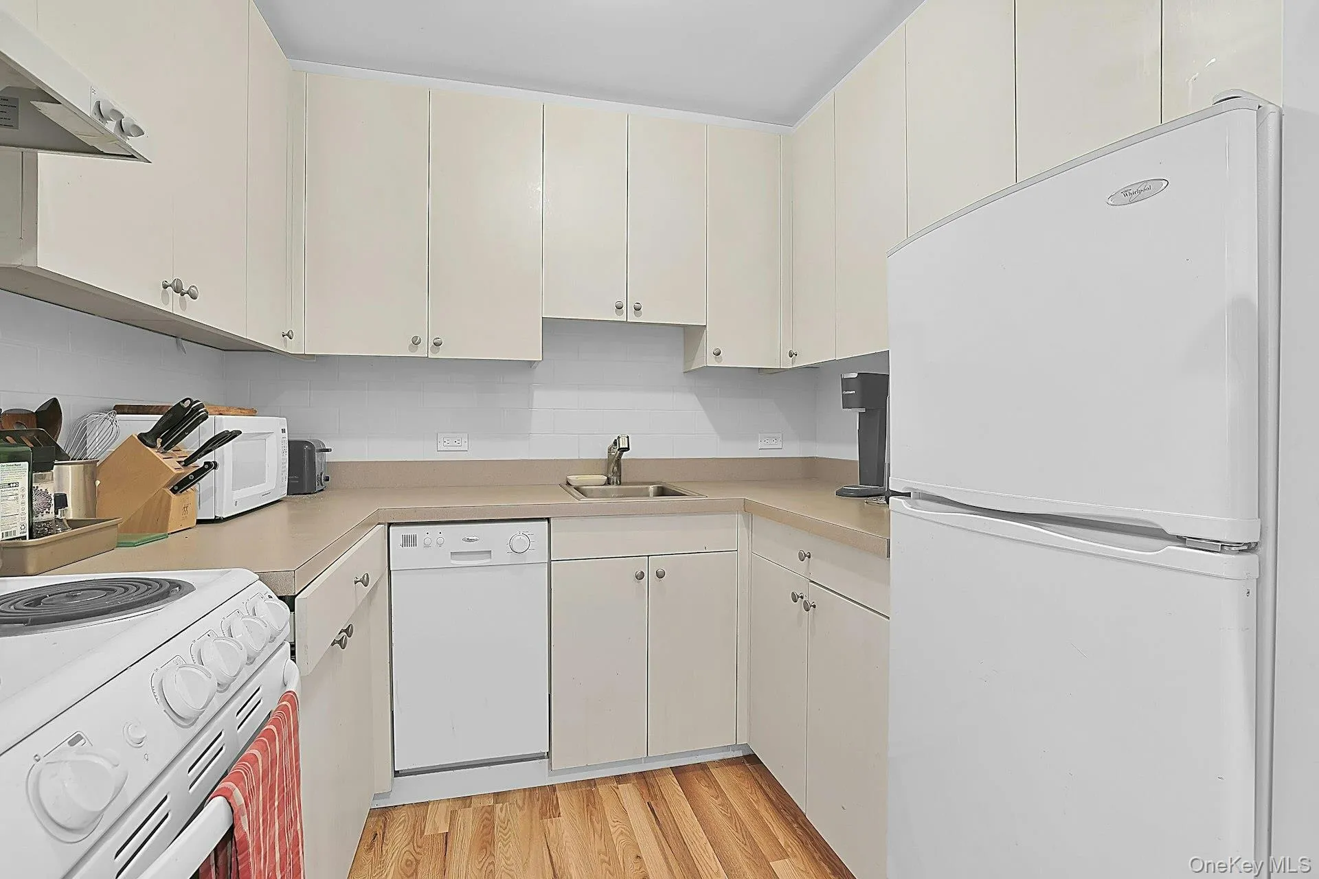 The cottage kitchen is a cozy and convenient space. Nearby, there is a full bathroom and a washer/dryer as well. The cottage kitchen is a cozy and convenient space. Nearby, there is a full bathroom and a washer/dryer as well.