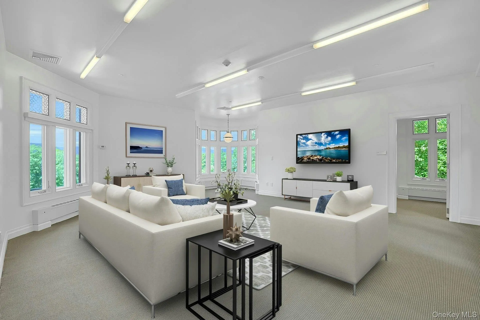 While staged as a comfortable family room, this expansive space could also easily be a primary bedroom. With some of the best views in the house, and the extension of the tower bay windows from the parlor below, this is a particularly striking room. Through the doorway on the right is a second room, perfect for a walk-in closet or, potentially, an attached bathroom. While staged as a comfortable family room, this expansive space could also easily be a primary bedroom. With some of the best views in the house, and the extension of the tower bay windows from the parlor below, this is a particularly striking room. Through the doorway on the right is a second room, perfect for a walk-in closet or, potentially, an attached bathroom.