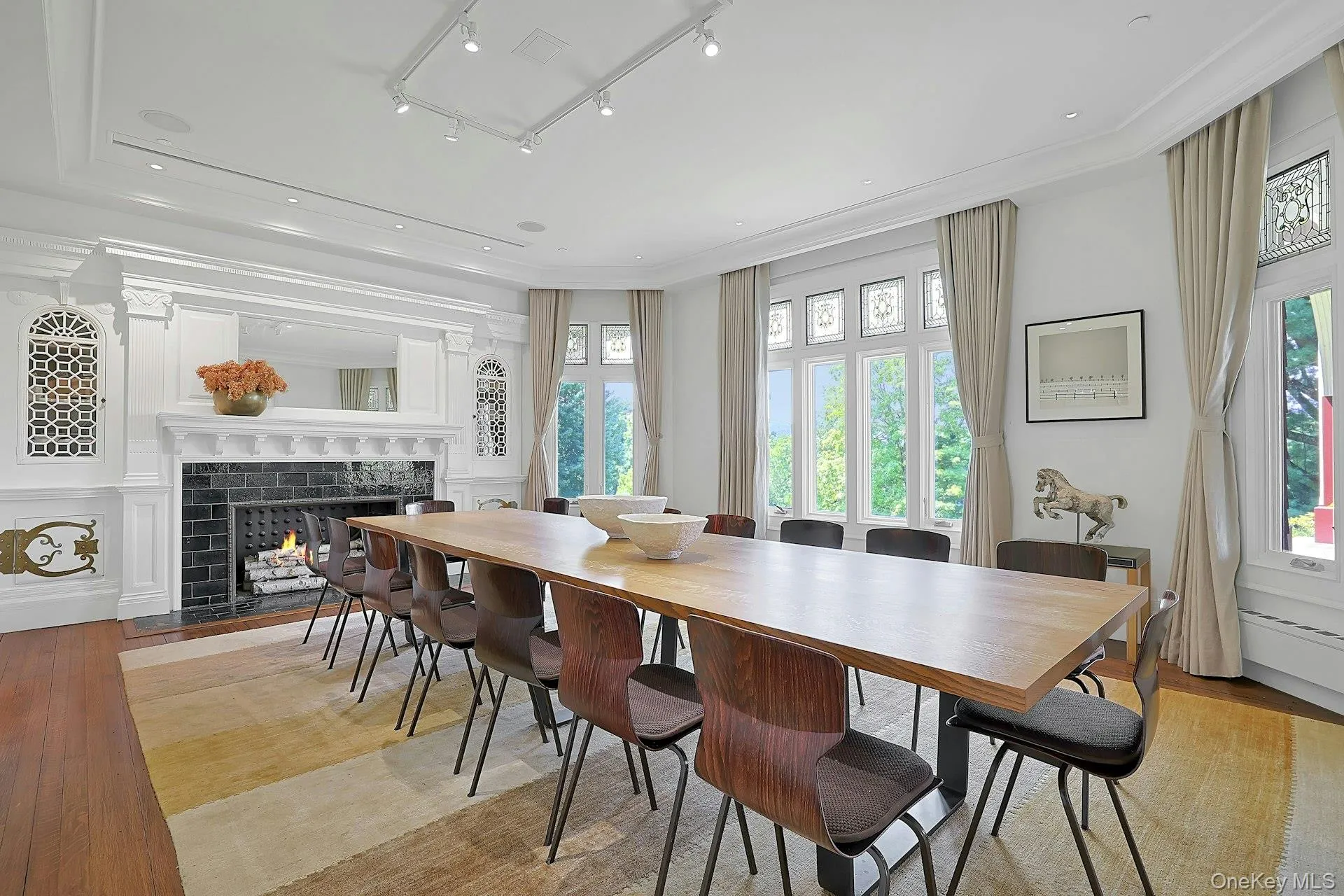The expansive dining room (used now as a conference area) is open to the living room. Clearly, there is ample space for large dinner parties! Sliding doors here as well can close this space off. The expansive dining room (used now as a conference area) is open to the living room. Clearly, there is ample space for large dinner parties! Sliding doors here as well can close this space off.