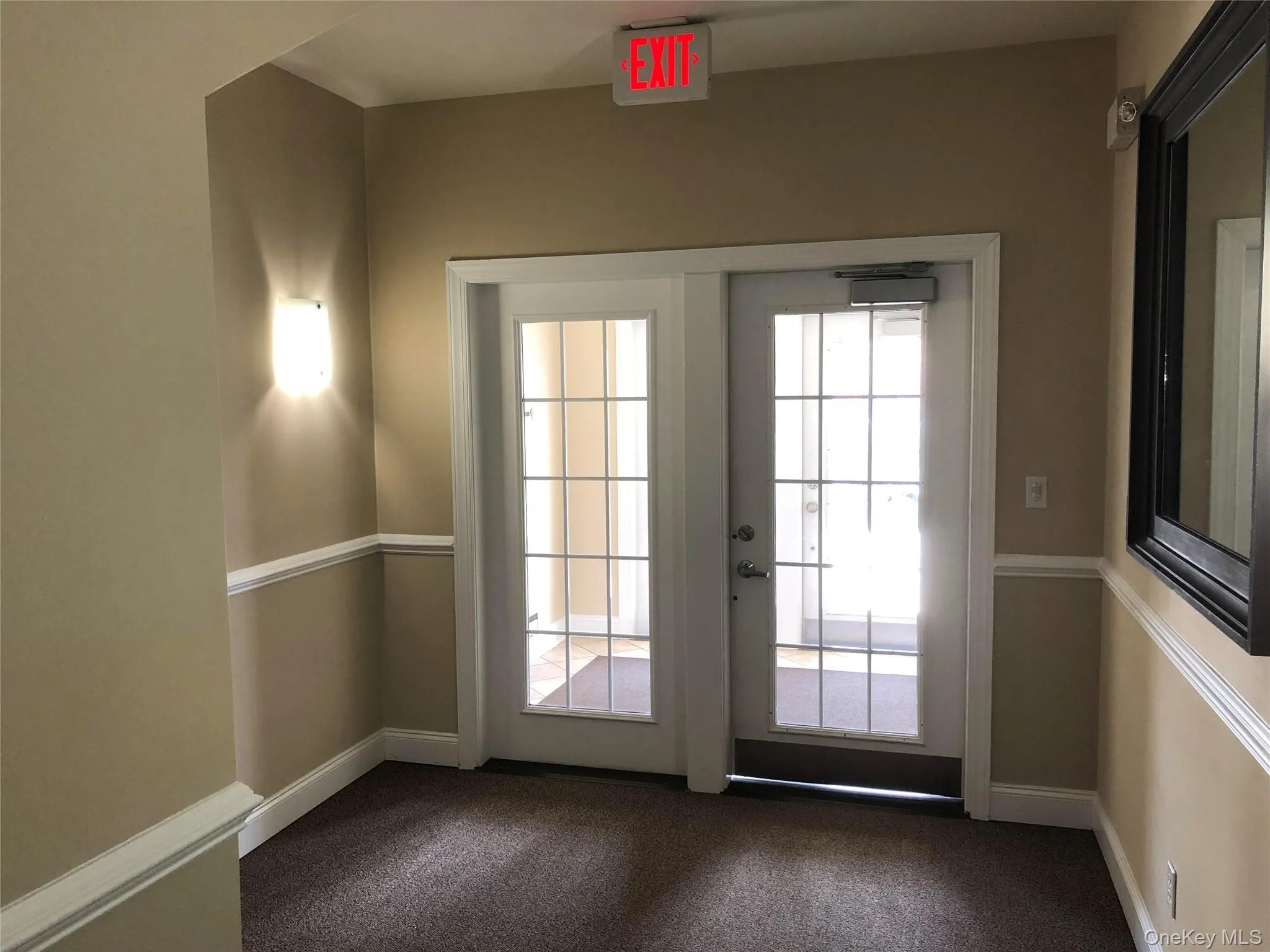 Double glass-paneled secured entry doors with grid detailing. Keypad access & locked mailboxes in this location. Double glass-paneled secured entry doors with grid detailing. Keypad access & locked mailboxes in this location.