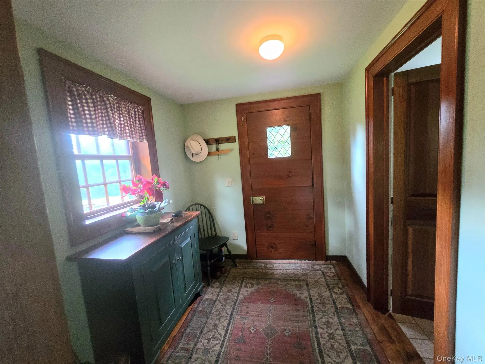 Wood-finish flooring with a decorative area rug Wood-finish flooring with a decorative area rug