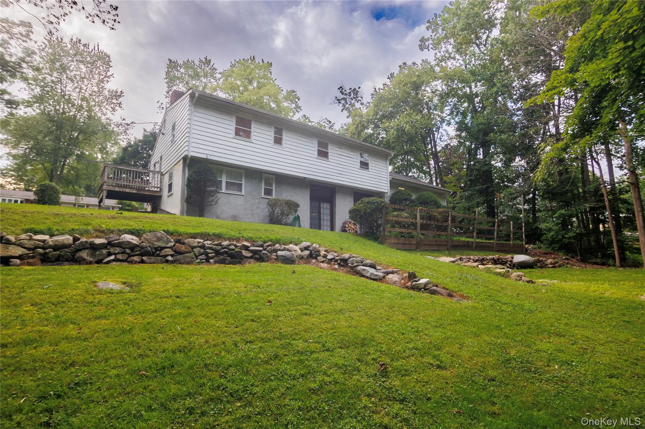 Rear of house with stucco walls. Great yard for entertaining. Rear of house with stucco walls. Great yard for entertaining.