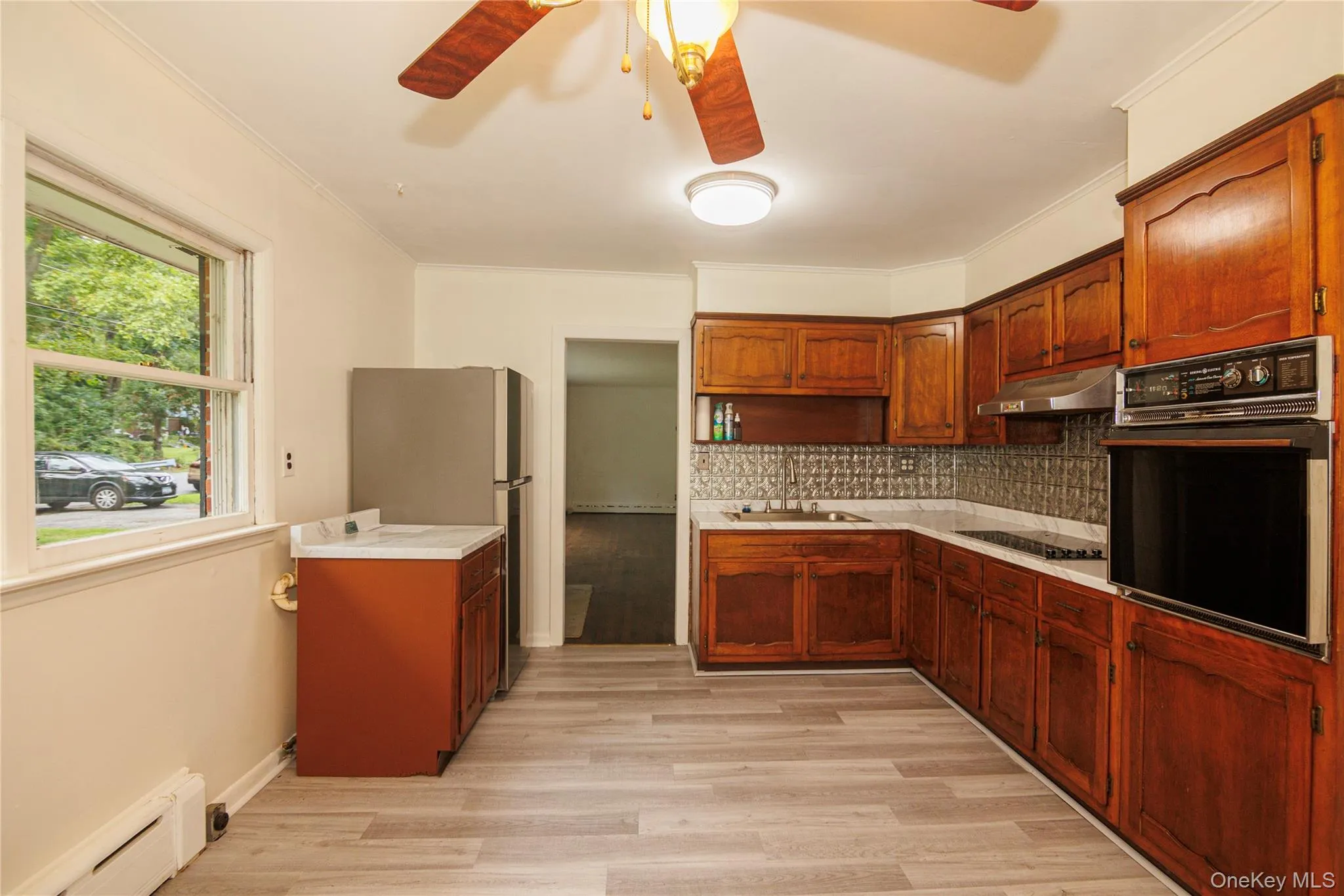 Large eat-in kitchen with newer stove top. Large eat-in kitchen with newer stove top.