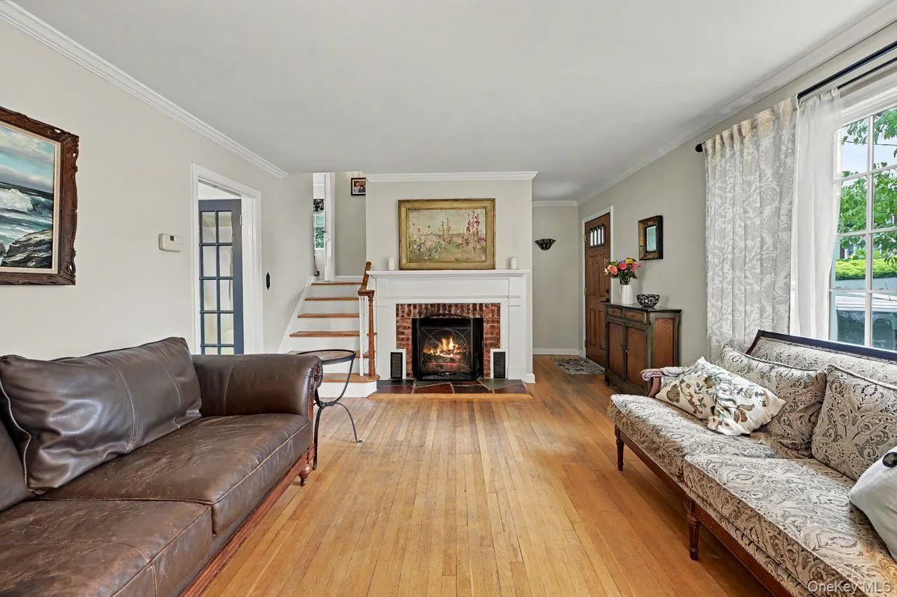 Entry hall on far right opens to the living room with a wood burning fireplace. Entry hall on far right opens to the living room with a wood burning fireplace.