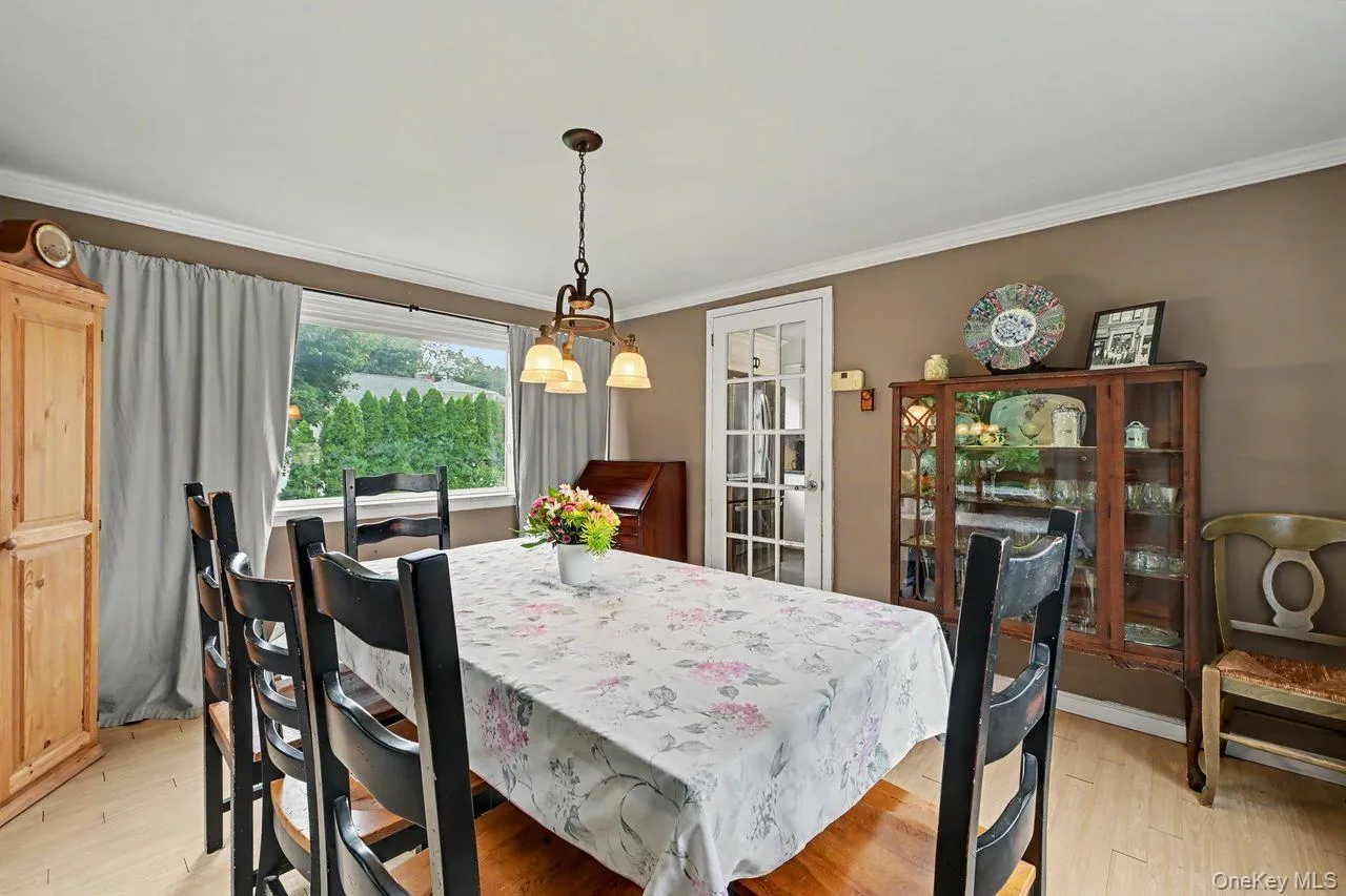 Dining room has oversized windows. Dining room has oversized windows.
