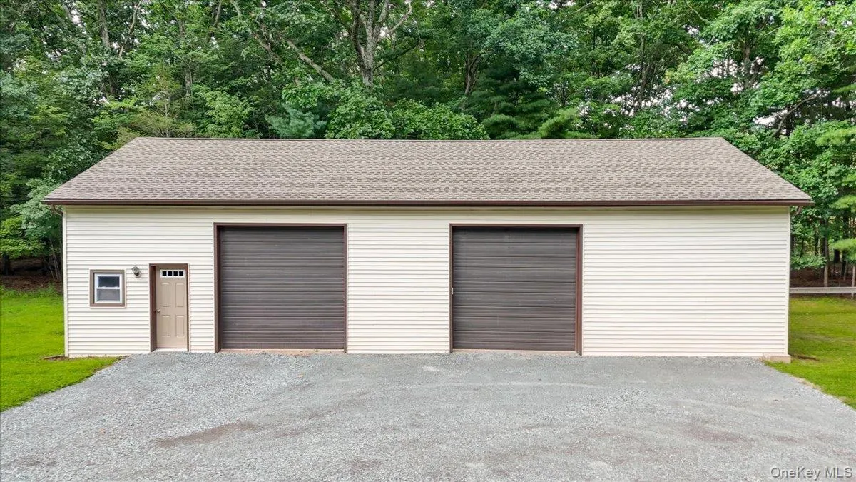 Pole Barn with side door and 2 10' garage doors. Pole Barn with side door and 2 10' garage doors.