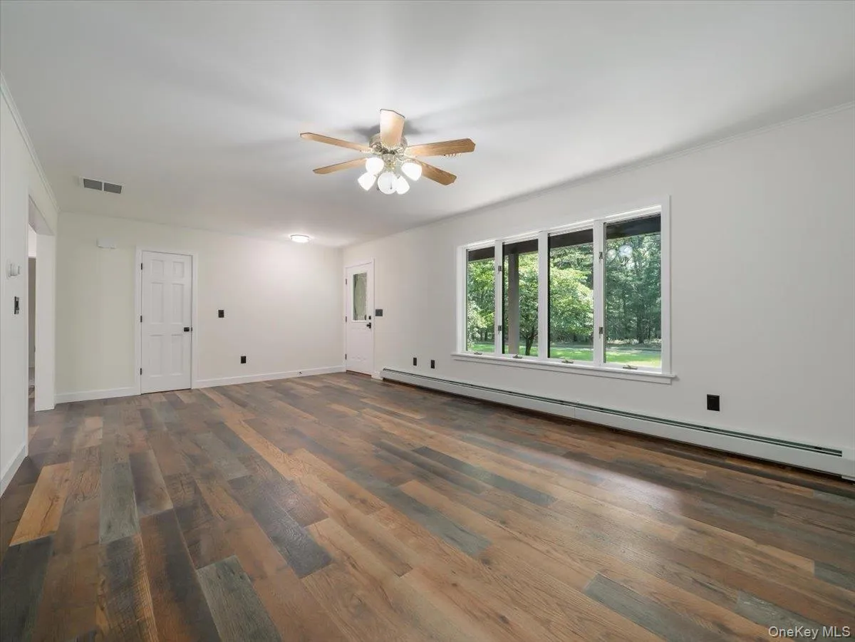 Door to entrance in front, closet and dining area on left Door to entrance in front, closet and dining area on left
