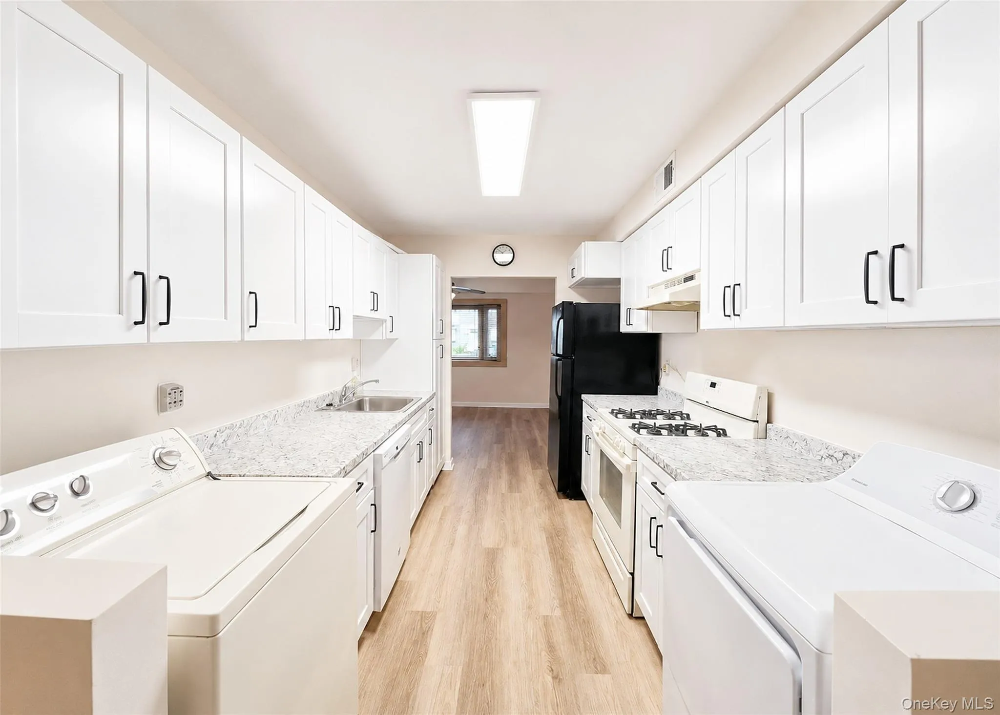 2 Month Old Kitchen With Plenty Of White Cabinetry & New Wide-Plank Oak Laminate Flooring. 2 Month Old Kitchen With Plenty Of White Cabinetry & New Wide-Plank Oak Laminate Flooring.